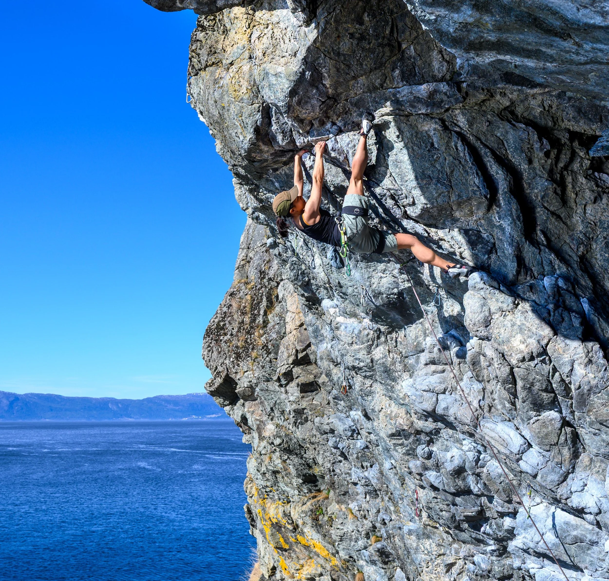 Anna Zhang climbing Den gule flekken (7a) at Korsvika, Trondheim, Norway.