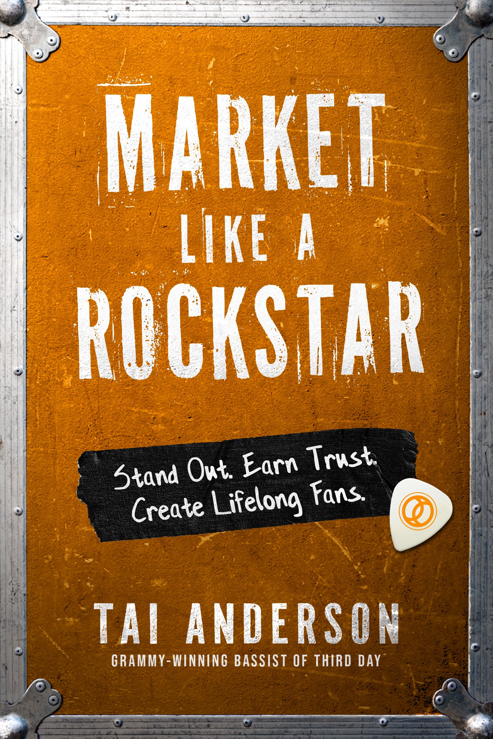 A sign with orange background and white distressed text reading 'Market like a Rockstar' and a black section with white handwritten text saying 'Stand Out. Earn Trust.' It features a white guitar pick with a yellow circular logo in the bottom right corner, attached with a metal clip to a metal frame on the side.