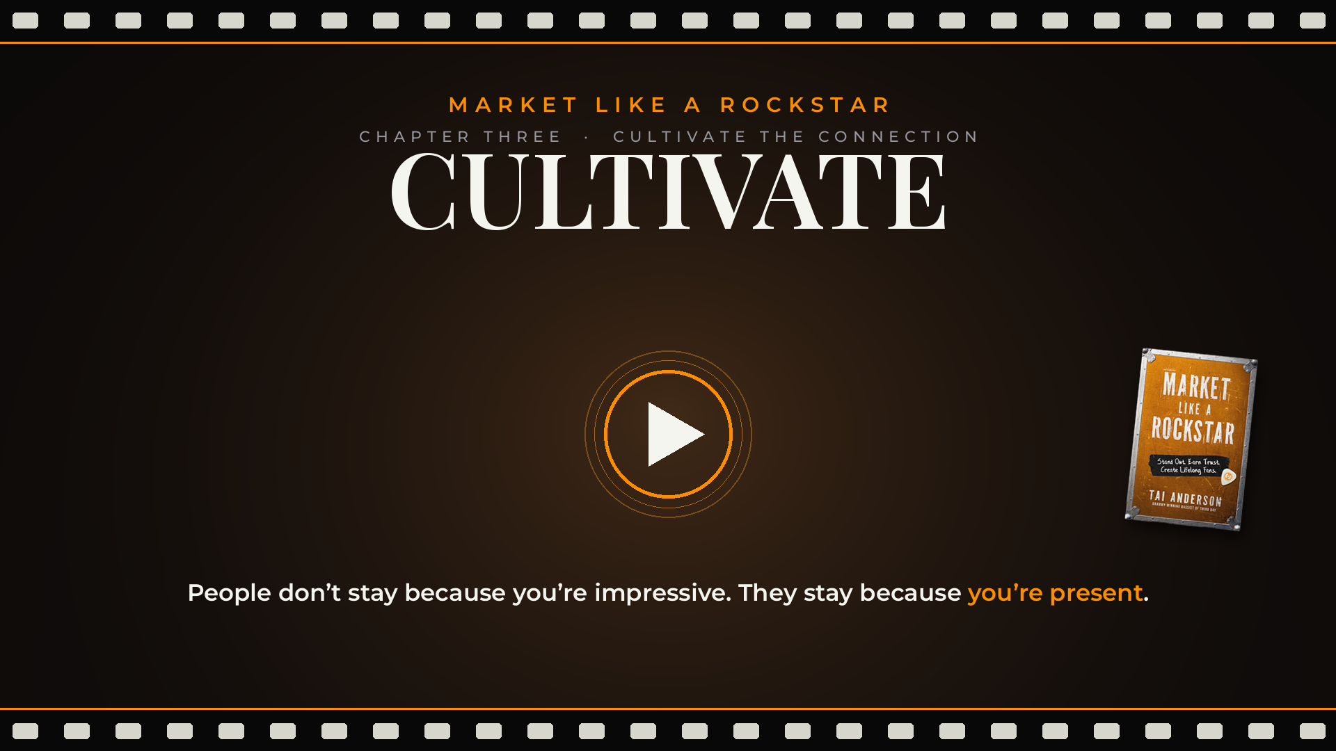 Video screen with a dark background and the text 'Market Like a Rockstar' at the top, a play button in the center, and a book titled 'Market Like a Rockstar' by Tai Anderson at the bottom right corner. A quote at the bottom says, 'People don't stay because you're impressive. They stay because you're present.'
