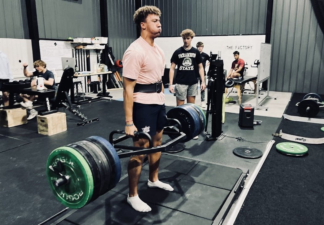 Athletes performing explosive power drills with Keiser functional trainers during a semi-private session in Castle Rock.
