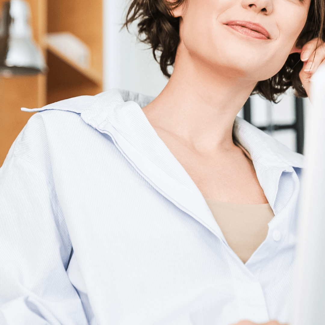 Woman leaning back with a relaxed, confident expression, symbolising self-belief and tuning out self-dou