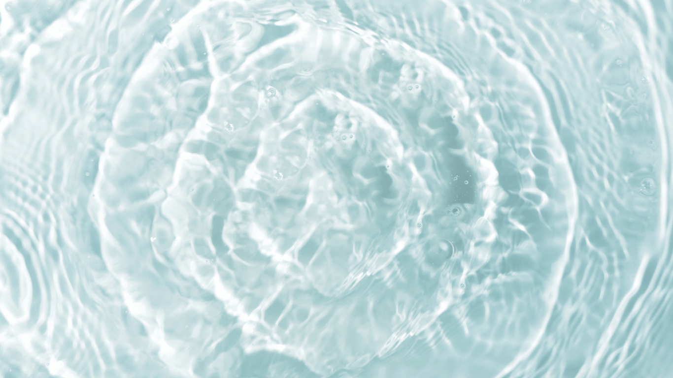 Gentle water ripples symbolising the softening of perfectionism and a more compassionate inner approach.