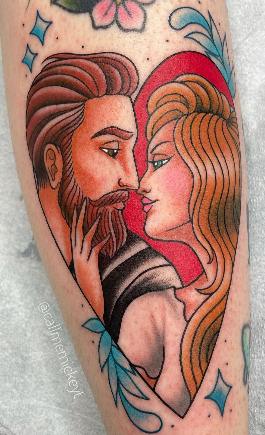 Traditional lovers tattoo in a heart
