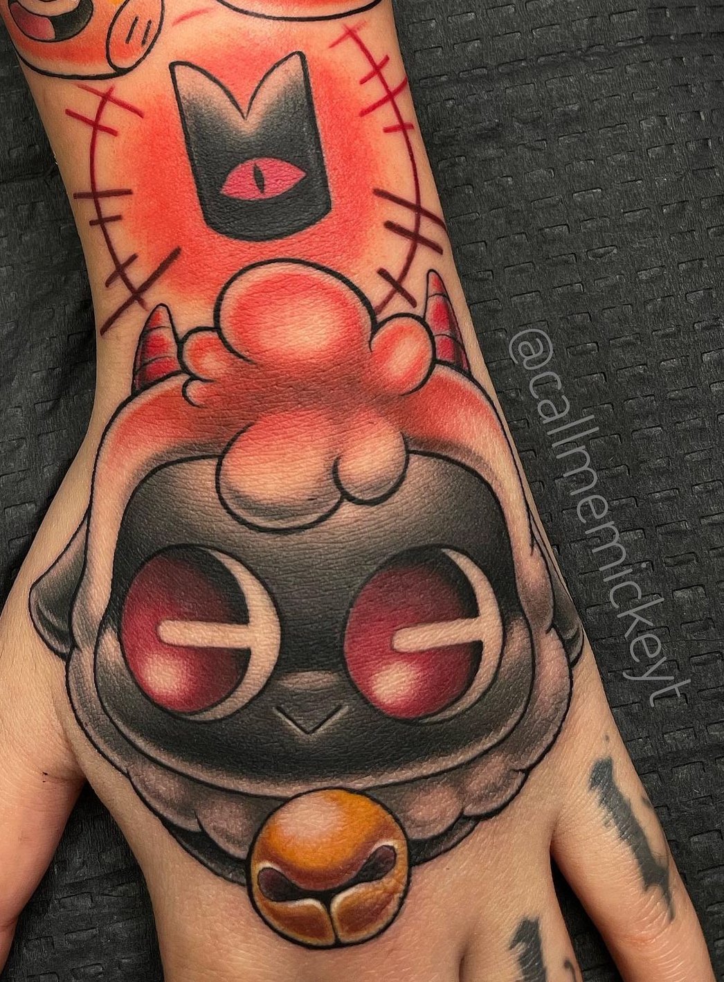 Cult of the lamb hand tattoo