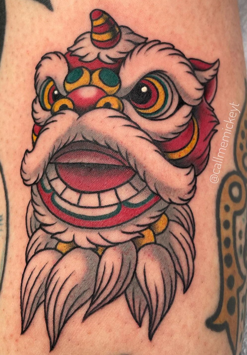 Traditional Asian lion dancer tattoo