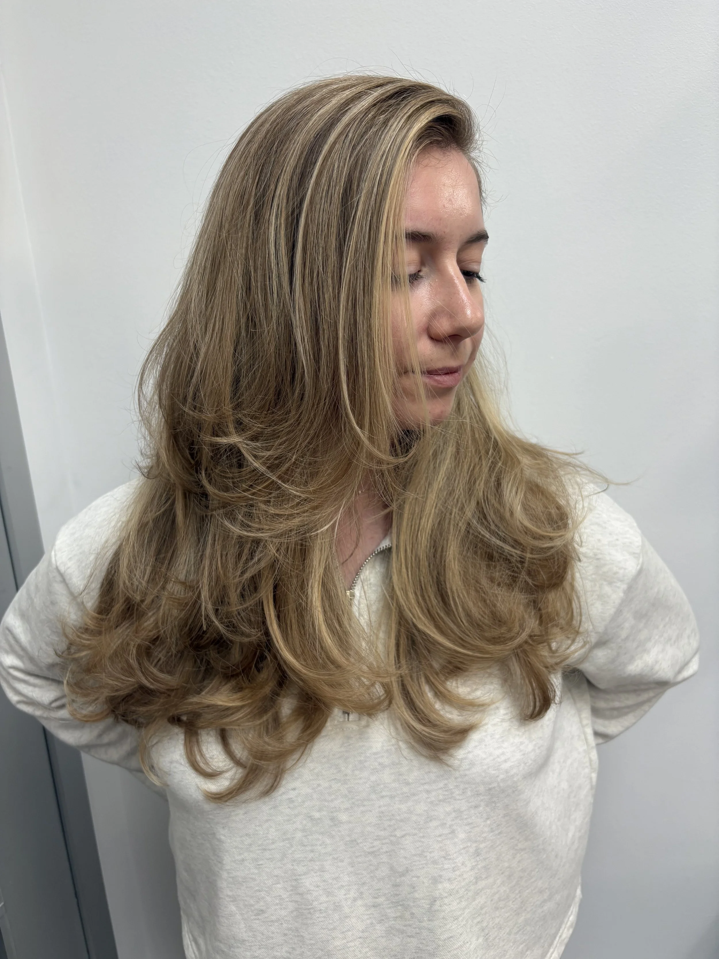 Little pops of blonde strategically placed can make a big overall impact. Jenna is the master at customizing your shade to accentuate your best features! 