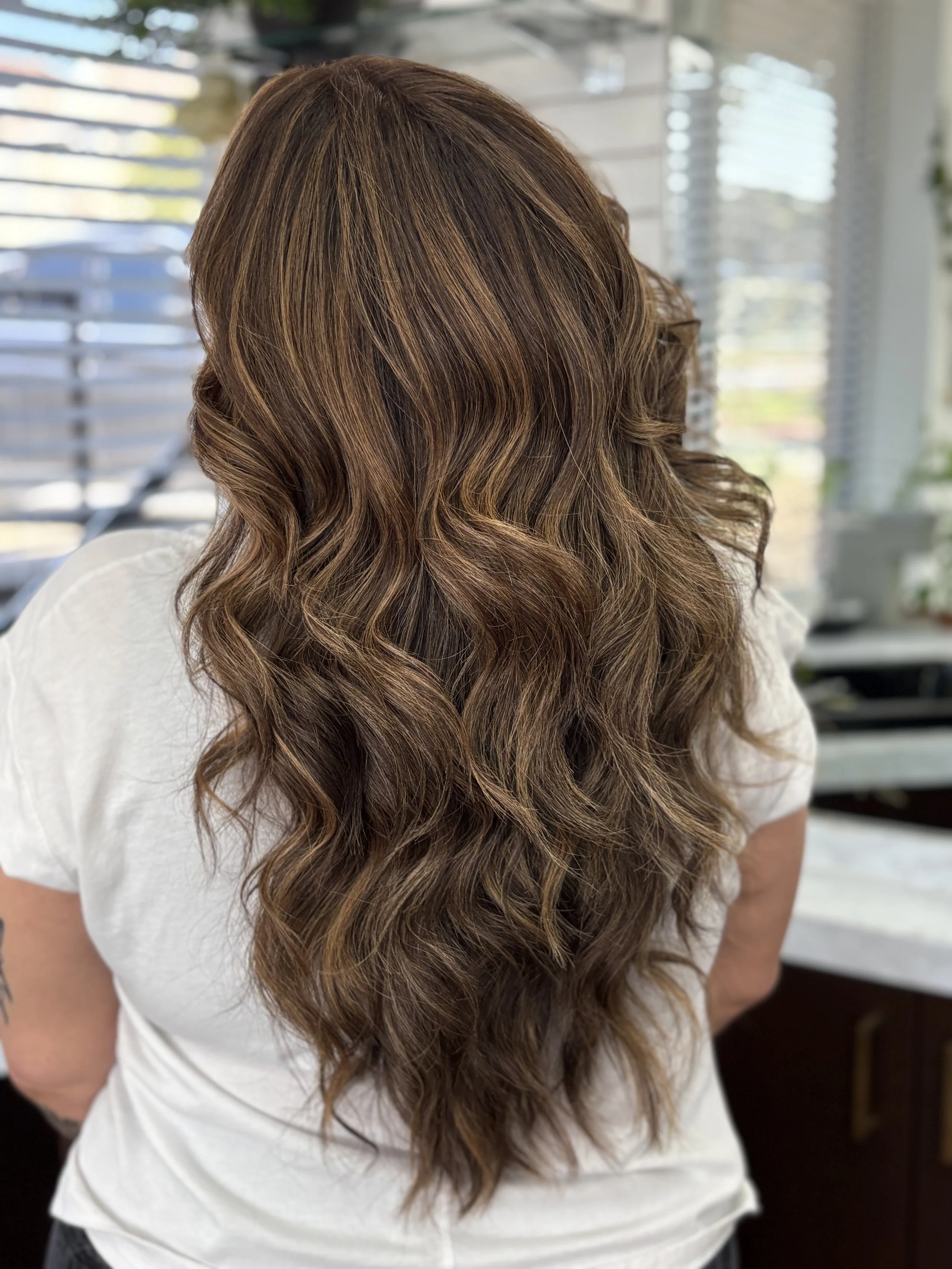Jenna excels in balayage with precise placement to make sure each strand blends and falls effortlessly. 