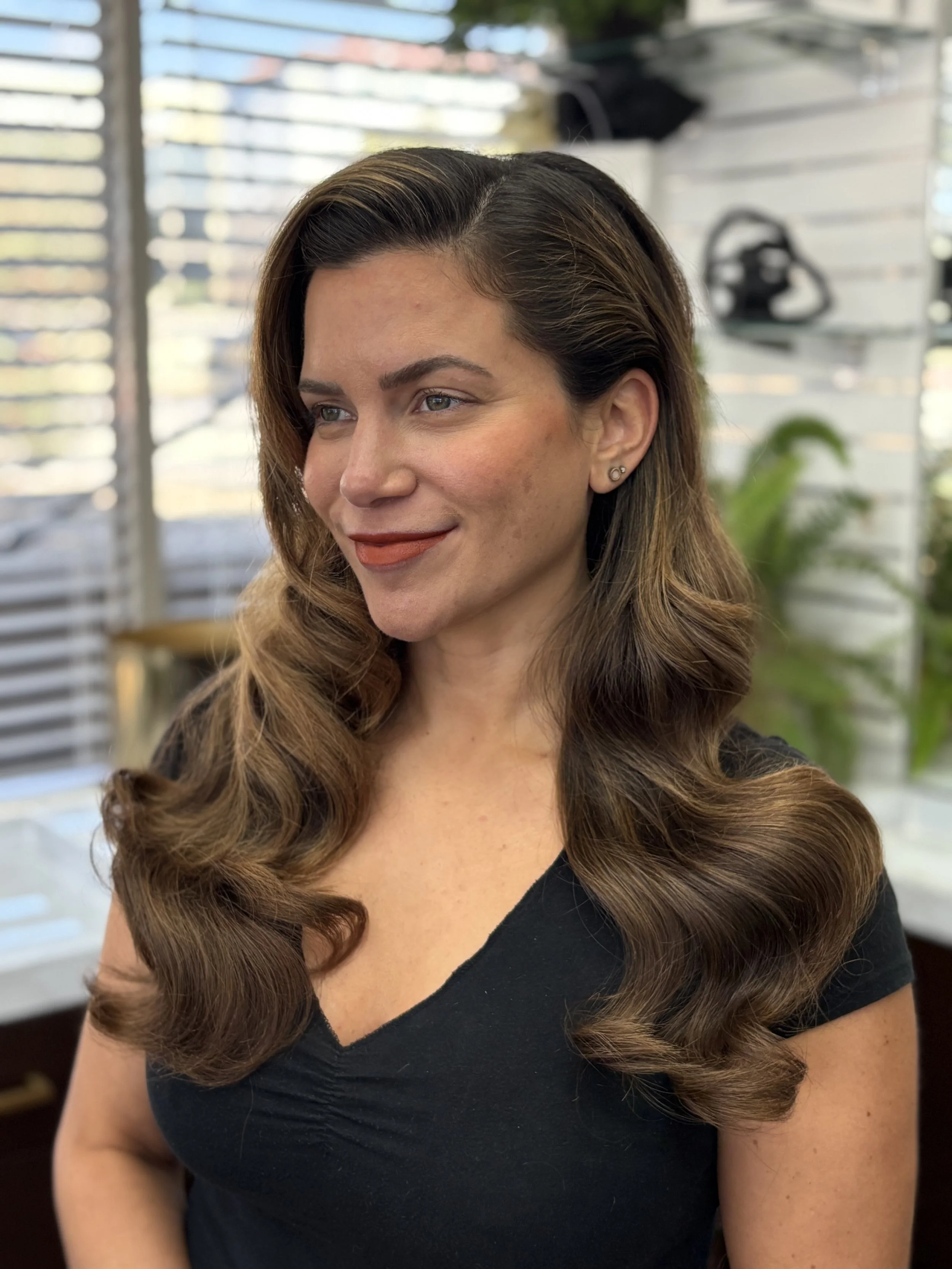 Before Laurel got married, we knew we wanted to add some dimension so her glamor waves would pop during her wedding. Careful not to damage her hair, we used a highlift instead of bleach to add some subtle dimension and shine with zero damage.