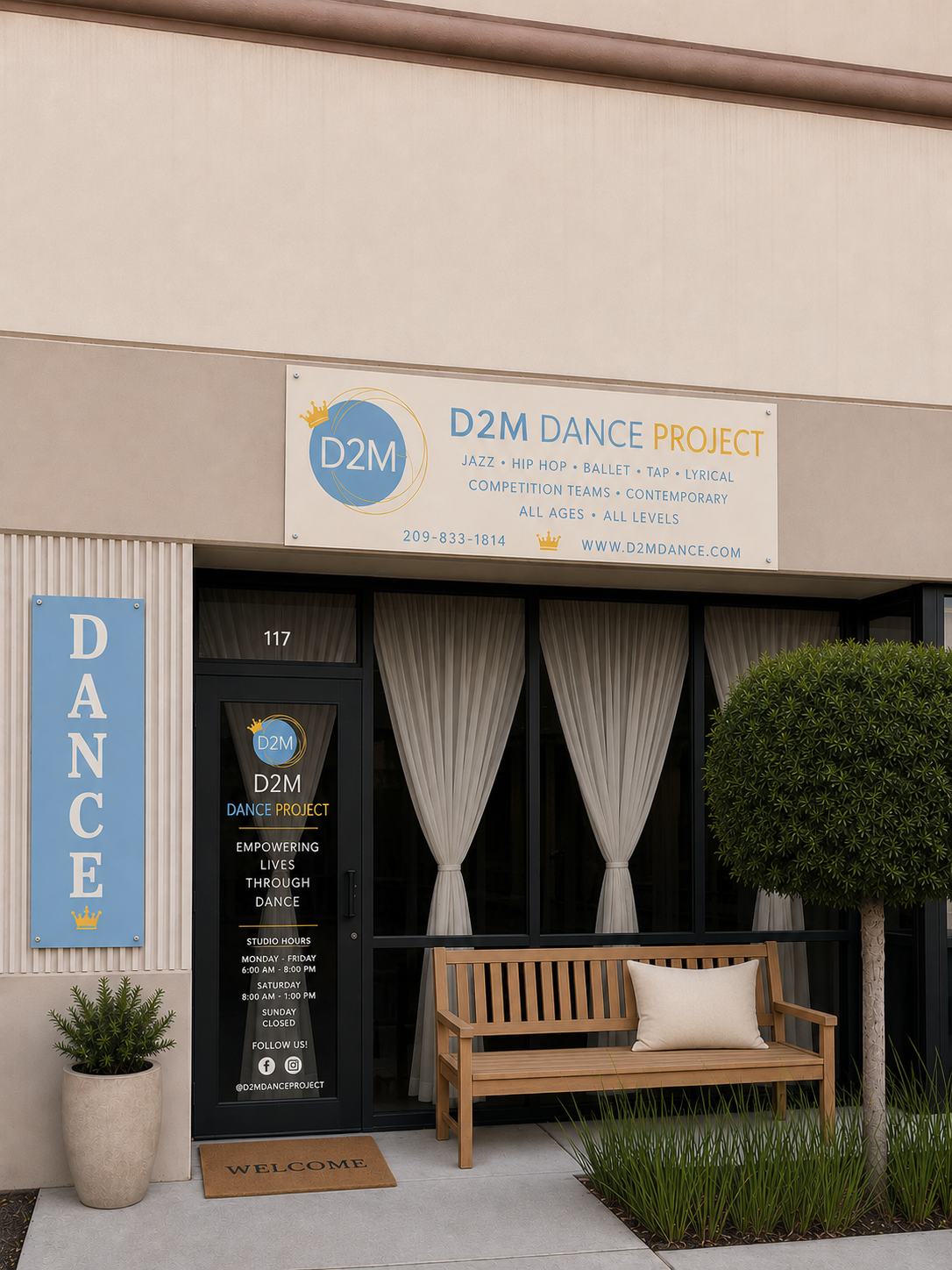 The entrance of a dance studio named D2M Dance Project featuring a large vertical sign, glass doors with curtains, and a welcome mat outside. There is a wooden bench with a cushion, potted plants, and a tree.