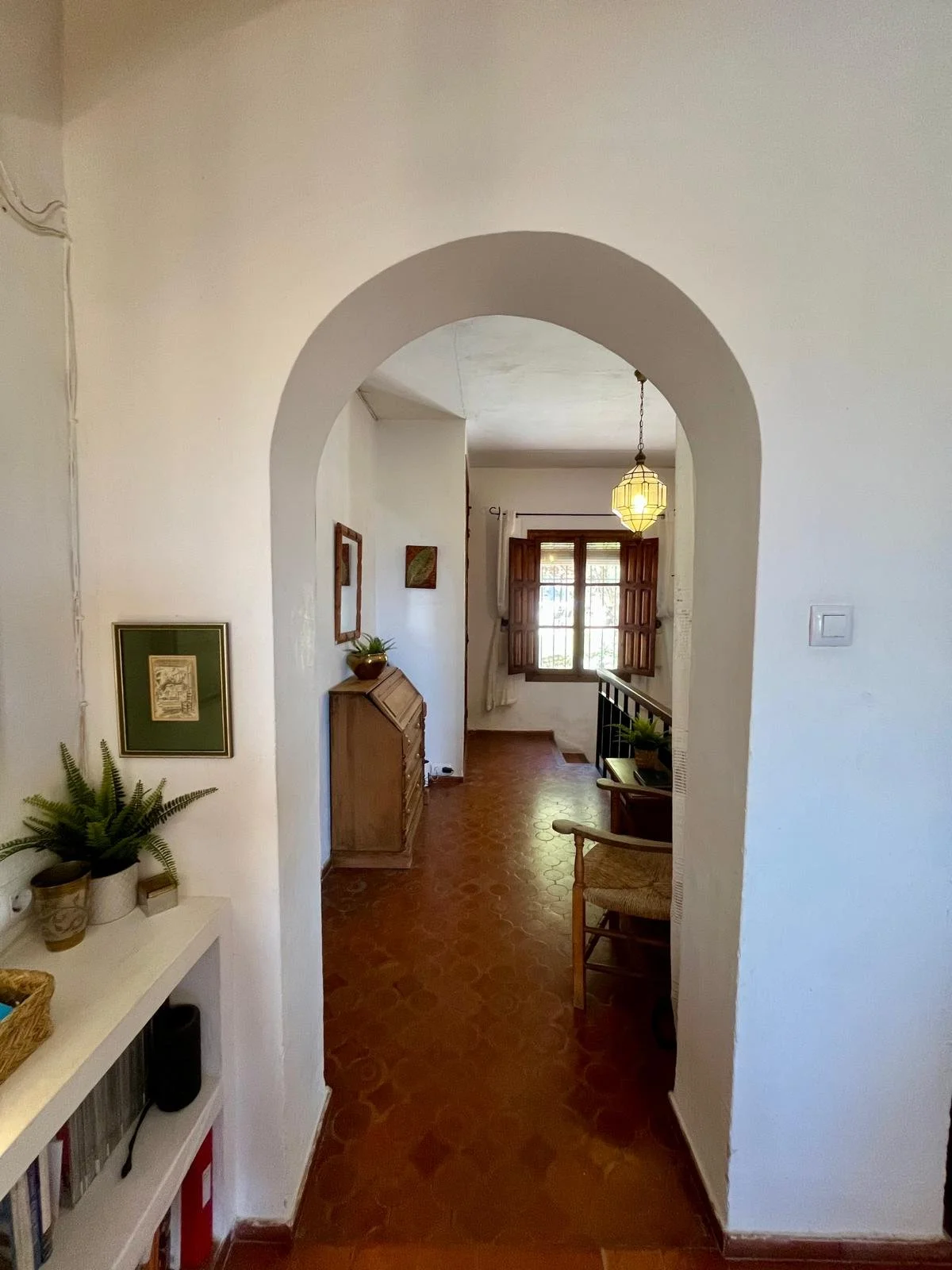The hall with steps down to the 3 lower ground floor bedrooms.