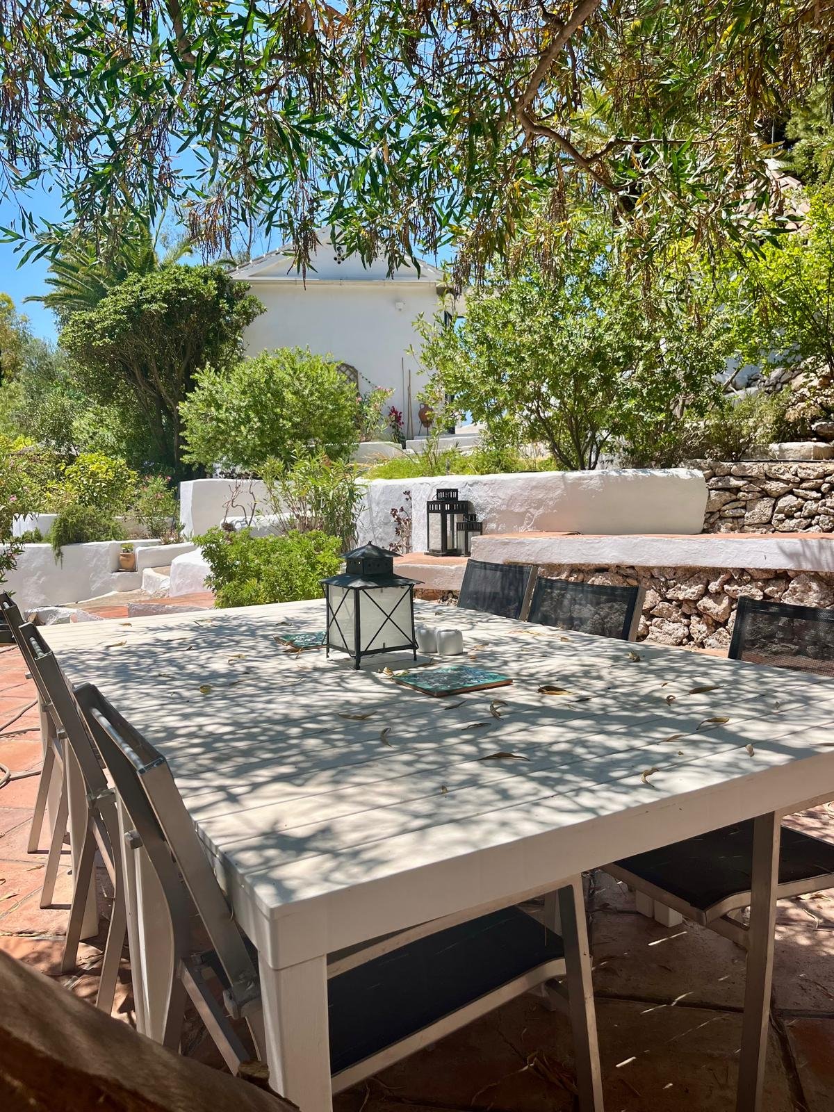 The large table under the mimosa tree on the Barbecue Terrace and looking up the steps to 'Garage Alto' - the Games Room...a fun way to end your evening.