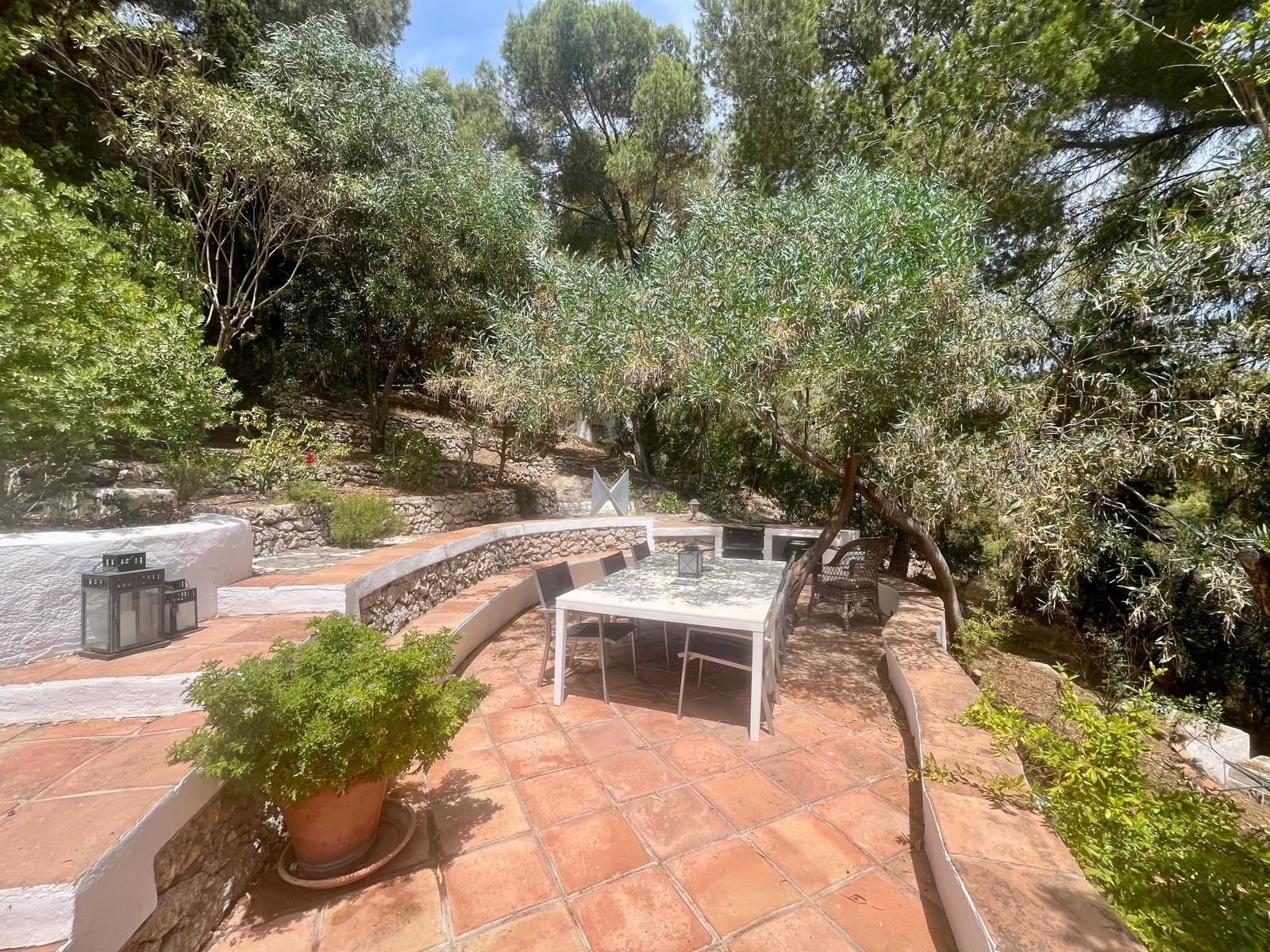 The Barbecue Terrace is accessed from the kitchen. It's wonderful to eat out here surrounded by garden sculpture, pines and twinkly lights in the evening.