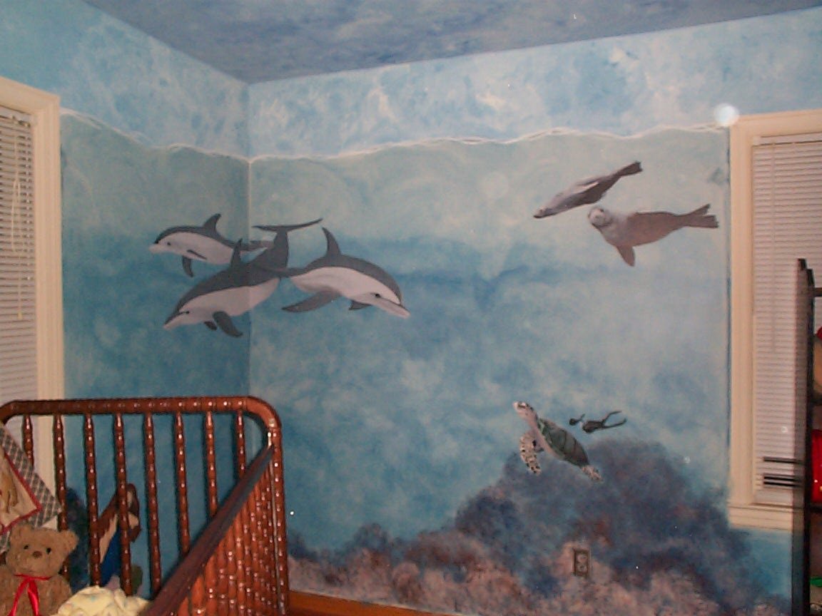 Corner view - dolphins, sea otters, sea turtle with divers