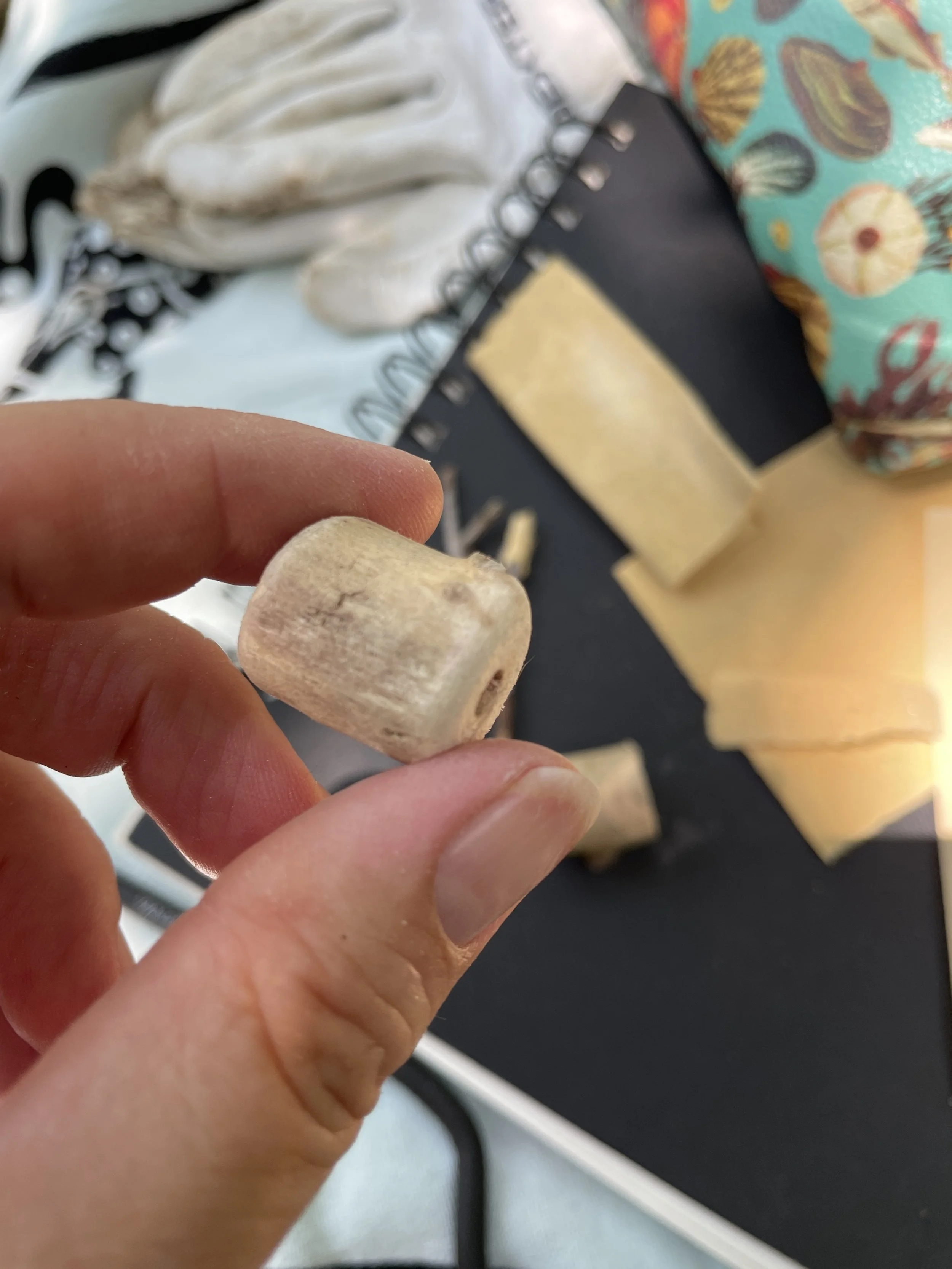 carving the signature bead cut and drilled from found wood