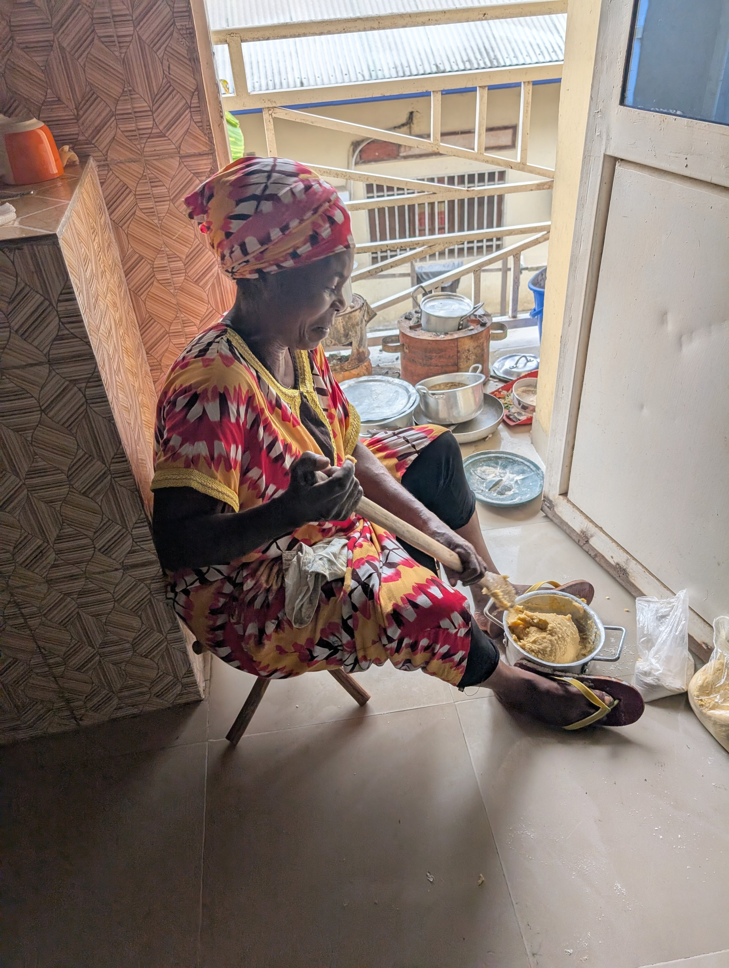 Beloved cook & caretaker Rehema prepares a staff meal at the Ida Lee House