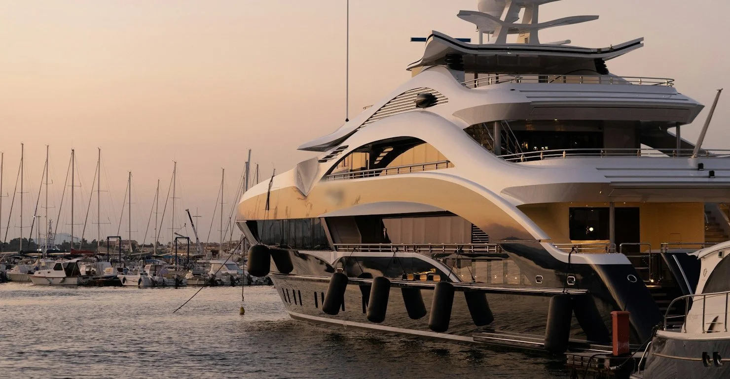 Superyacht moored at a marina at sunset