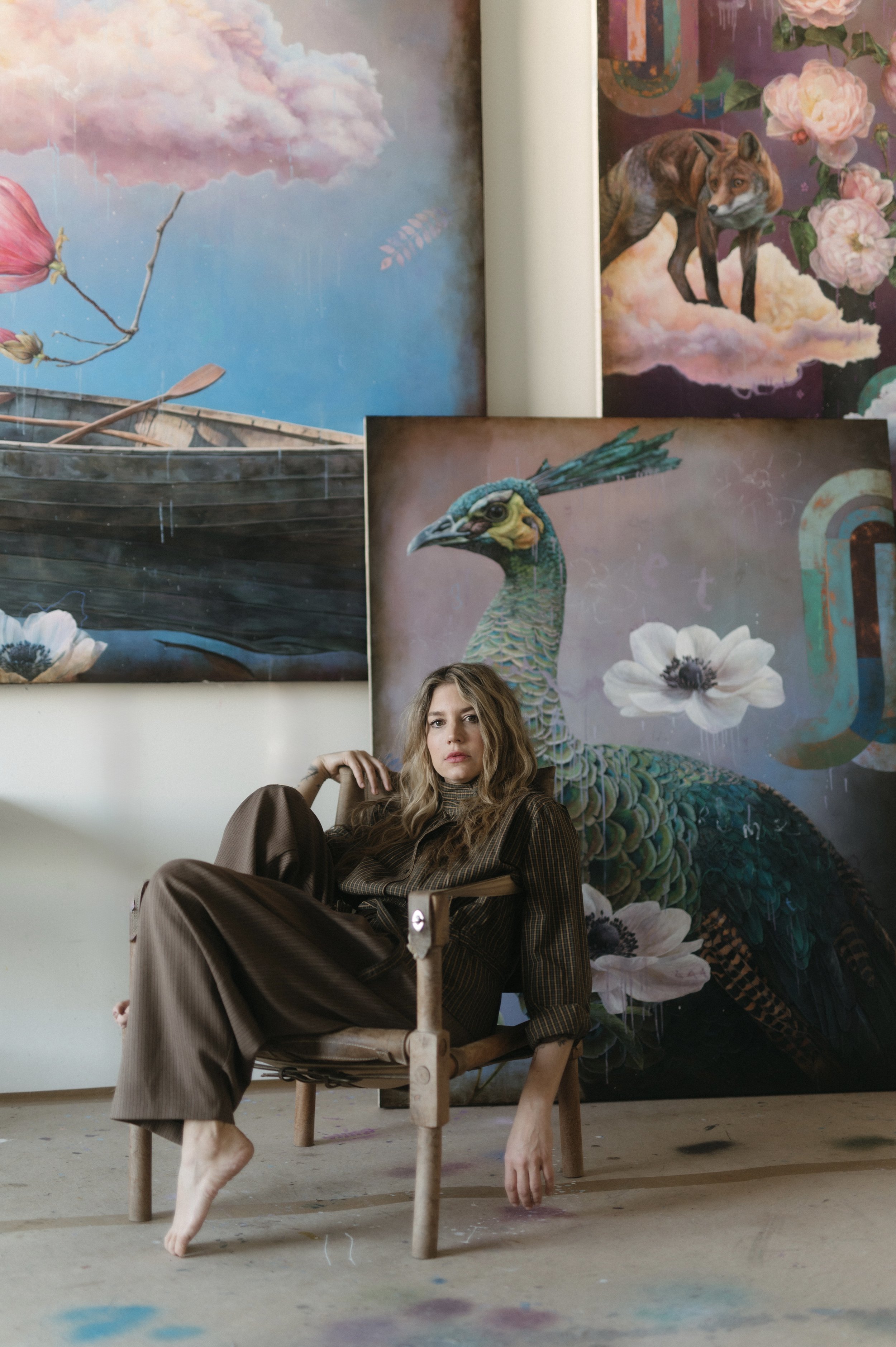 Sarah Helser, contemporary painter, in her studio at Dilworth Artisan Station, Charlotte NC, surrounded by works from The Blue Hour: Sovereign series.