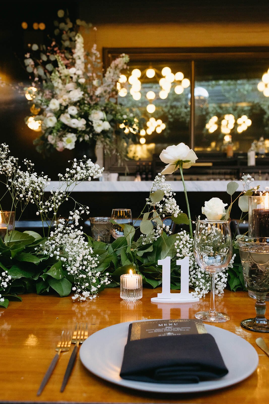Artfully designed wedding table setting featuring soft-toned florals and elegant dinnerware, inviting guests to a sophisticated dining experience