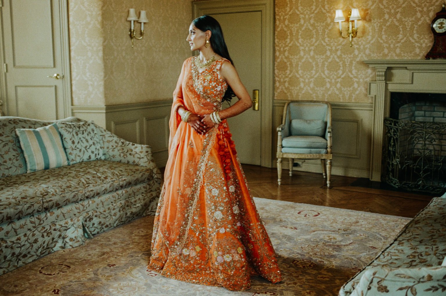 Bride in orange and gold Saree