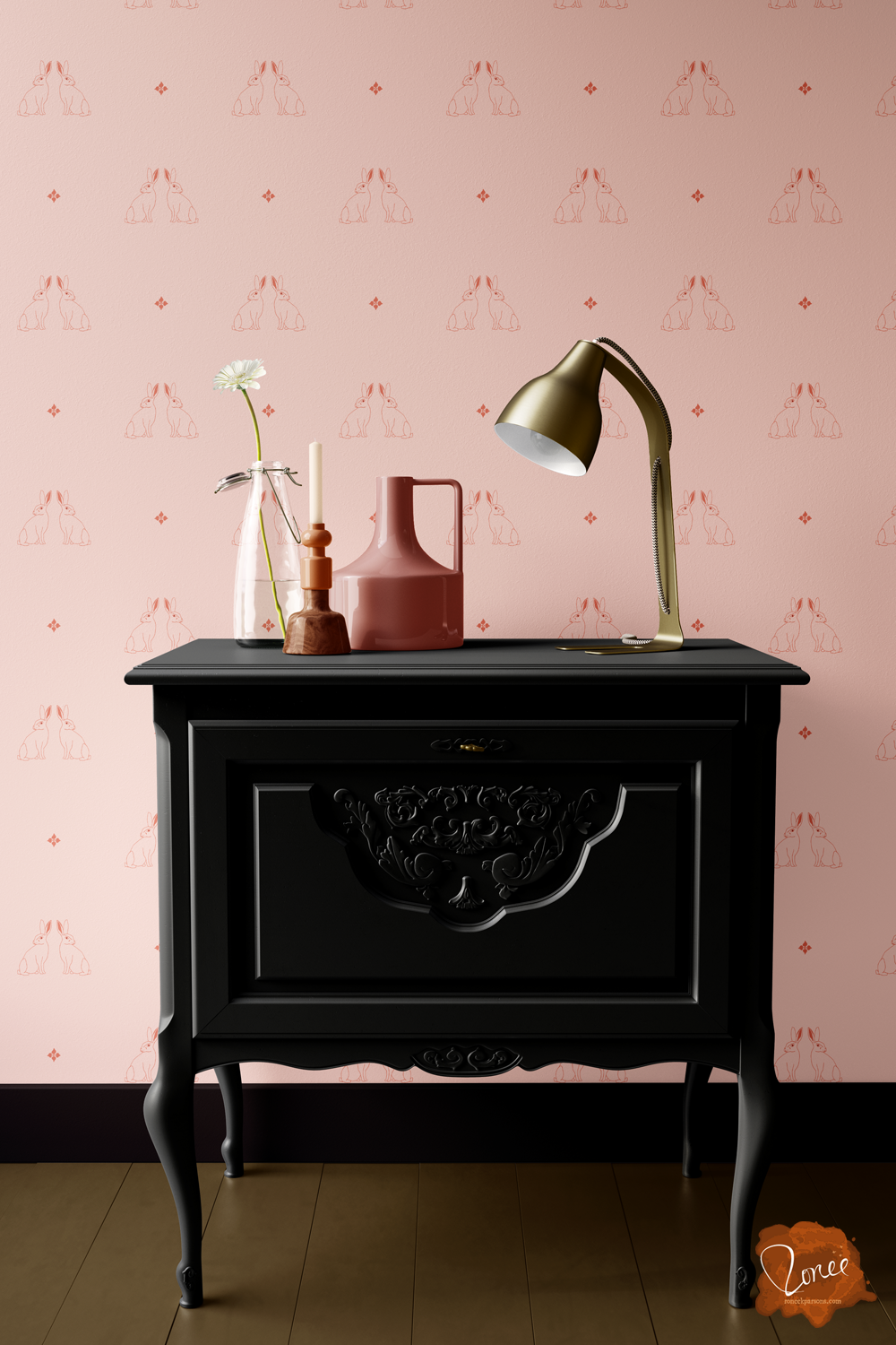 Cottagecore style pink bunnies wallpaper behind a vintage nightstand with a pink jug, brass lamp, and vintage candlestick holder on top.