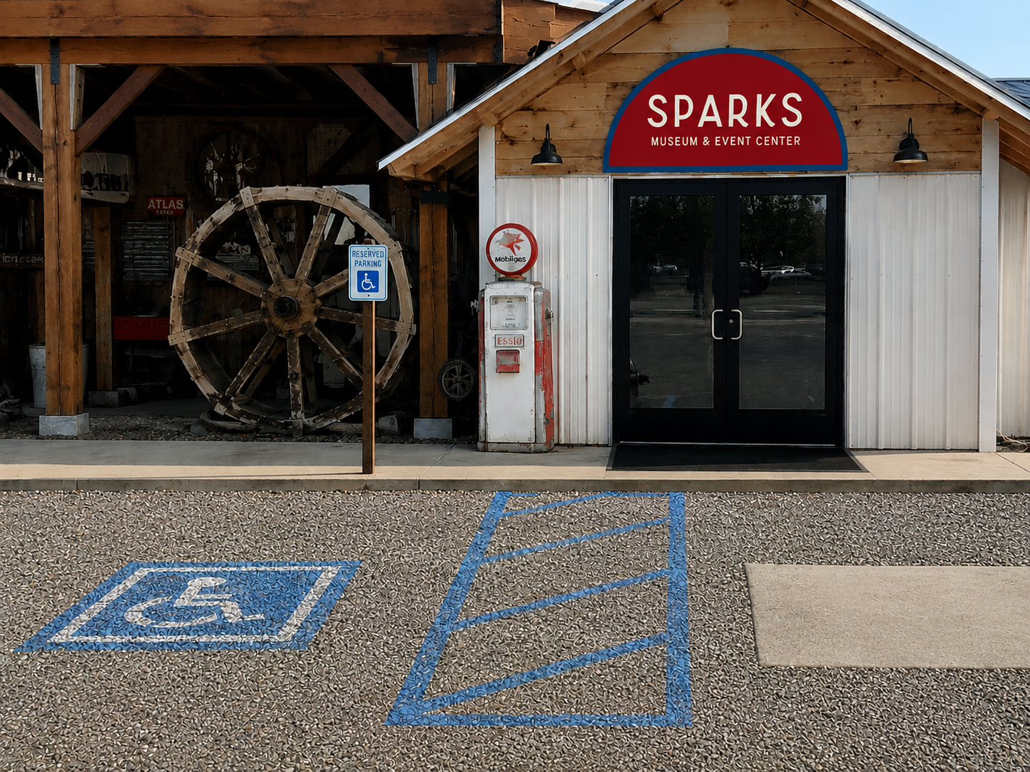 Accessible parking stalls marked beside the step-free West entrance of an event venue