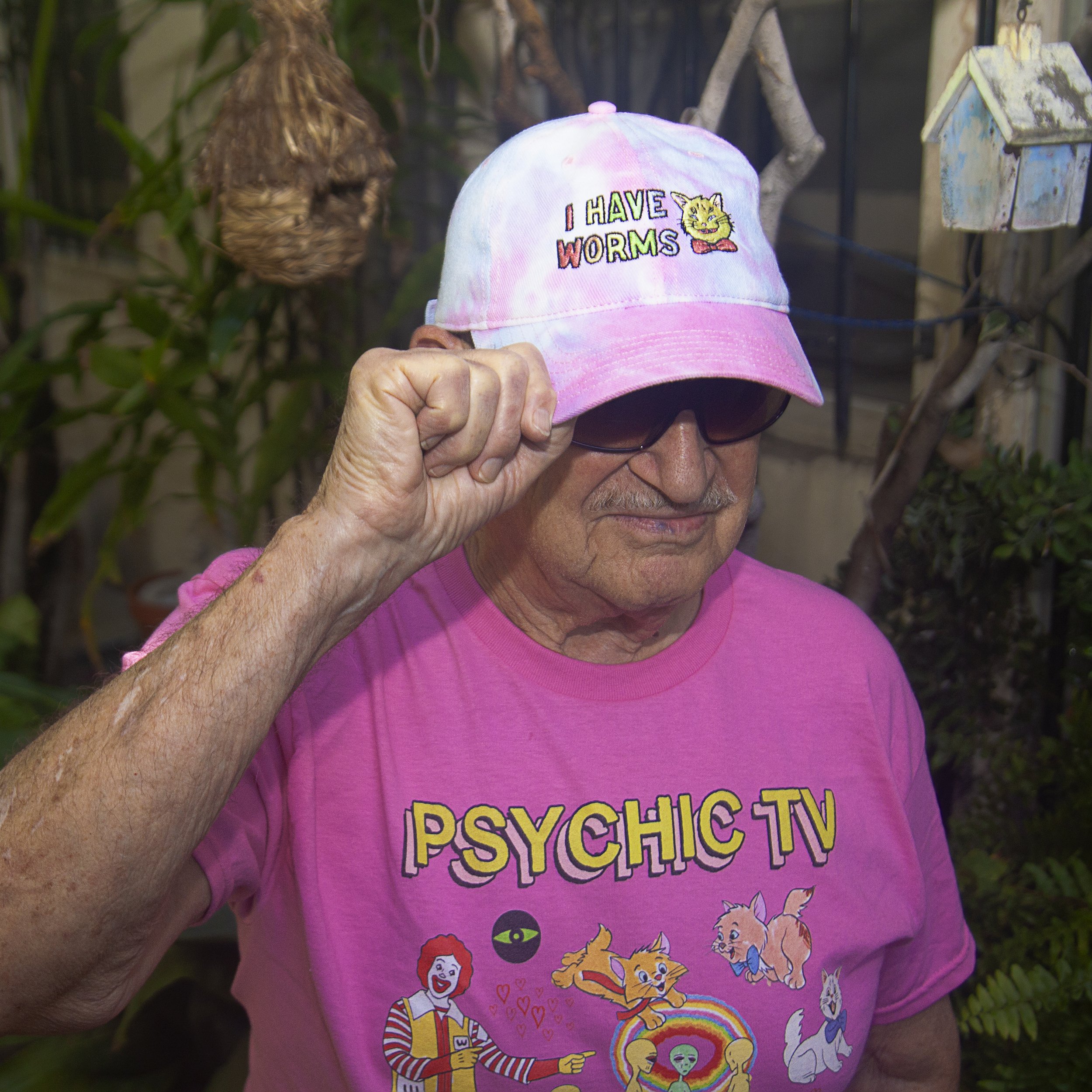 cartoon cat head with text "i have worms" on tie dye dad cap