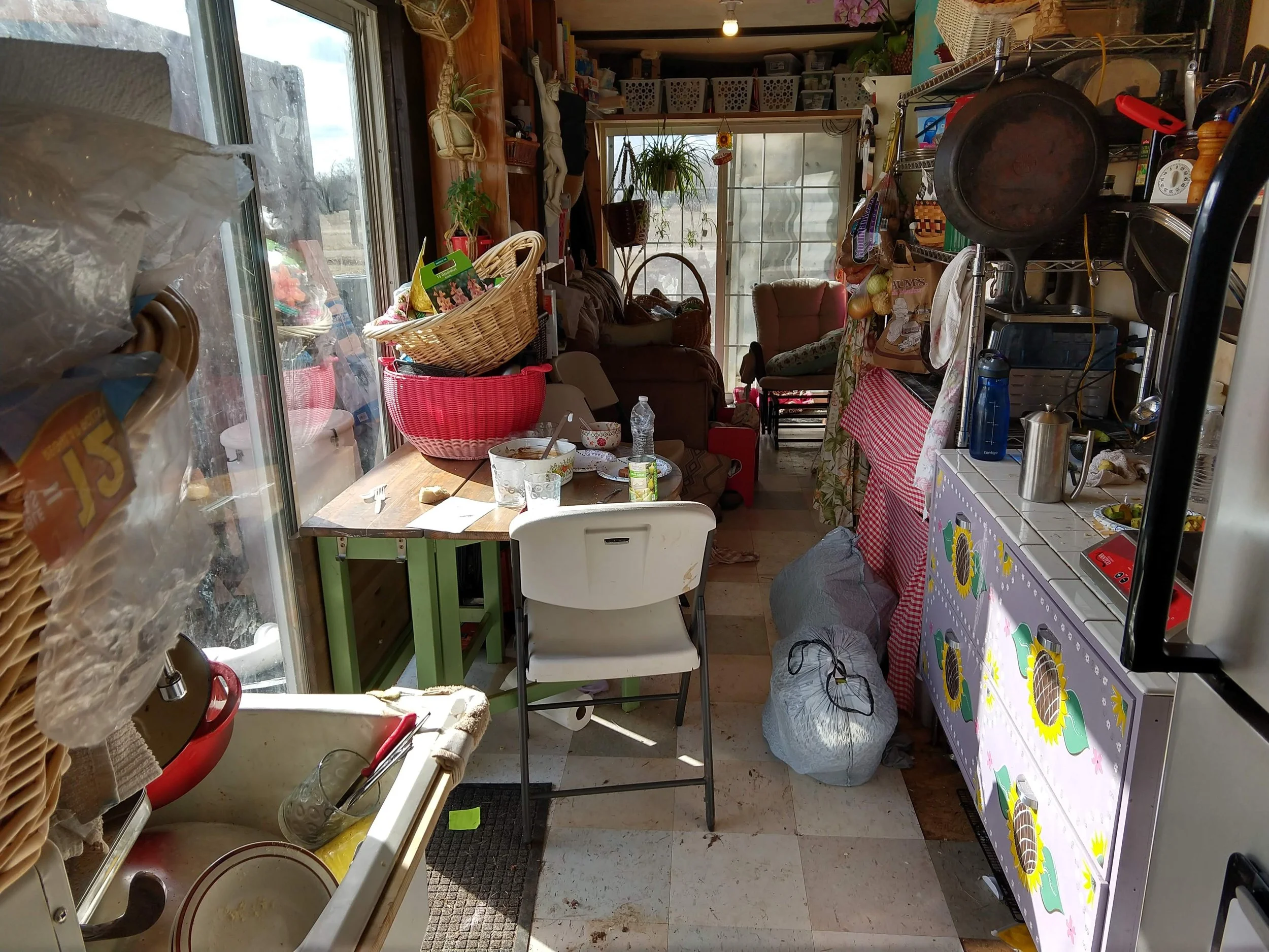 Inside the container. 4 kids, 2 adults, 2 big dogs, and a cat sharing the space.
