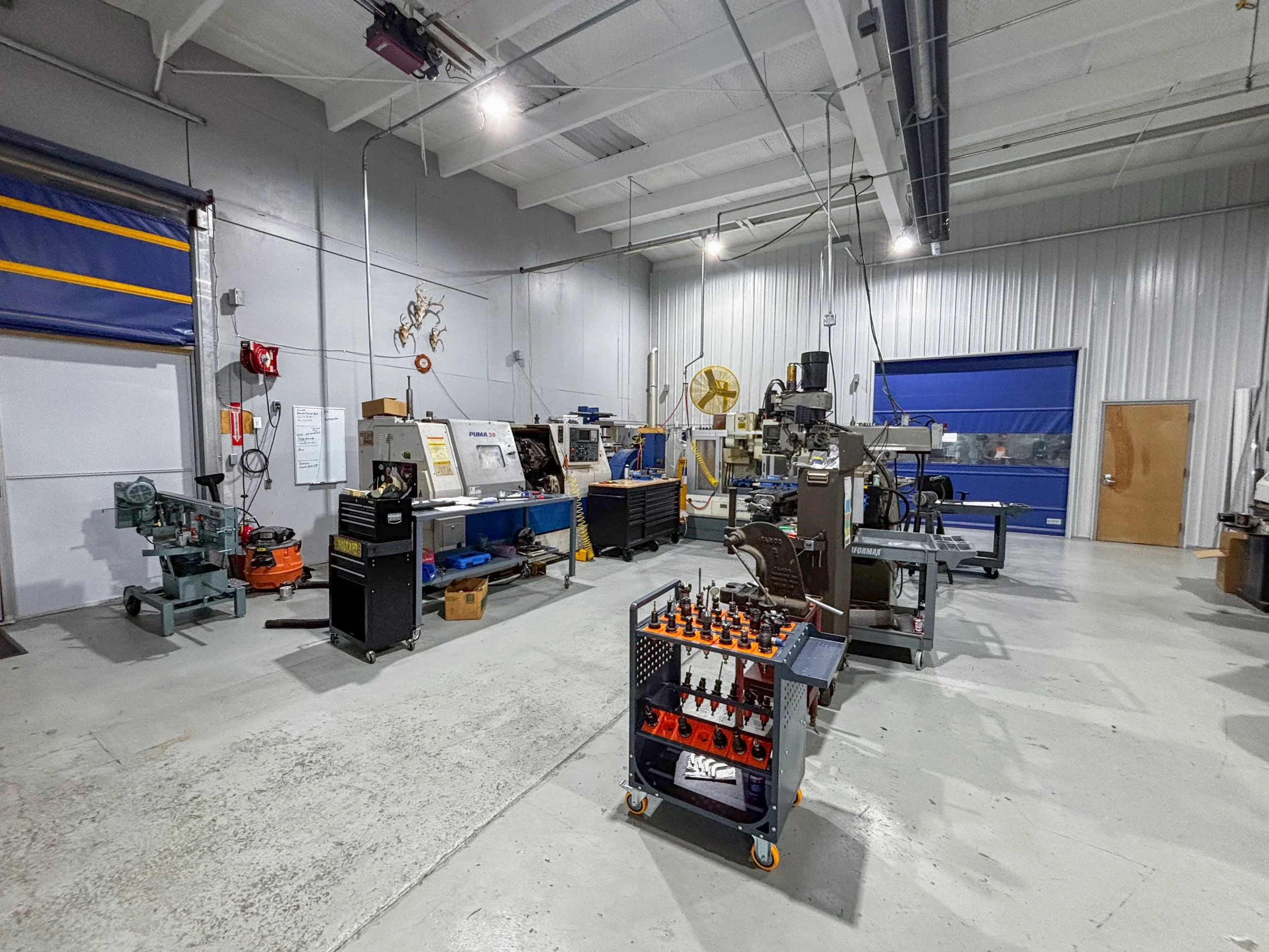 A manufacturing workshop with CNC machinery. Milling, Turning, CAD/CAM services.