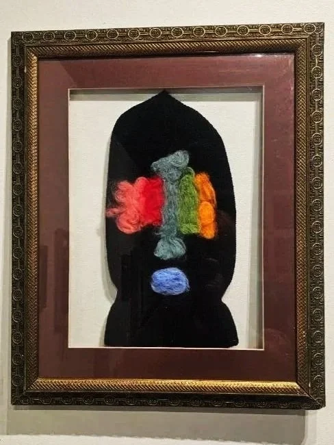 Installation Image I
Untitled
2025

black knit ski mask and wool roving in frame
15.75” x 16.5”