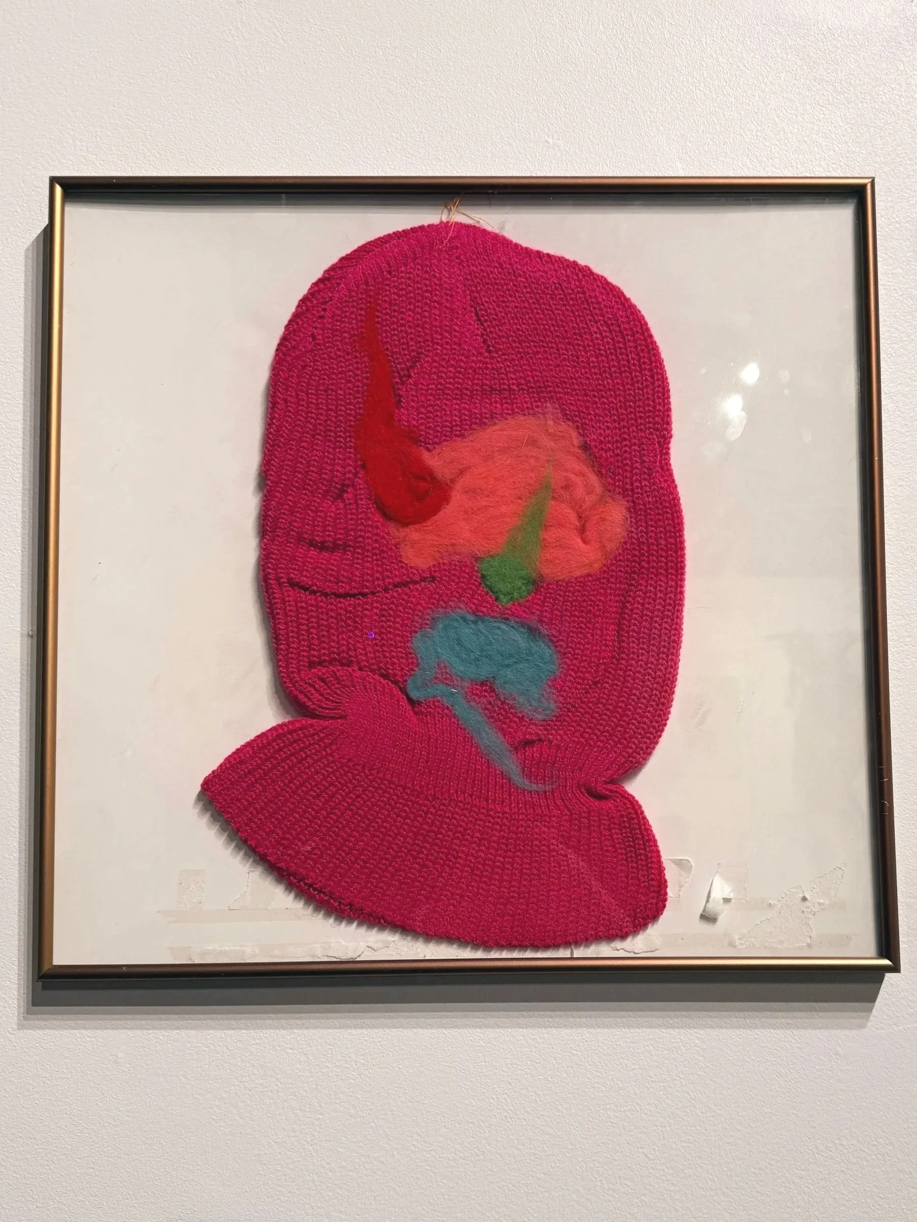 Installation Image I
String theory
2025
Nearly Lemon

pink knit mask and wool roving
15.75” x 16.5”