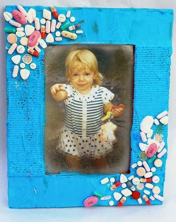 Inheritance, 2025, Mosaic blue frame pill mosaic with childhood photo