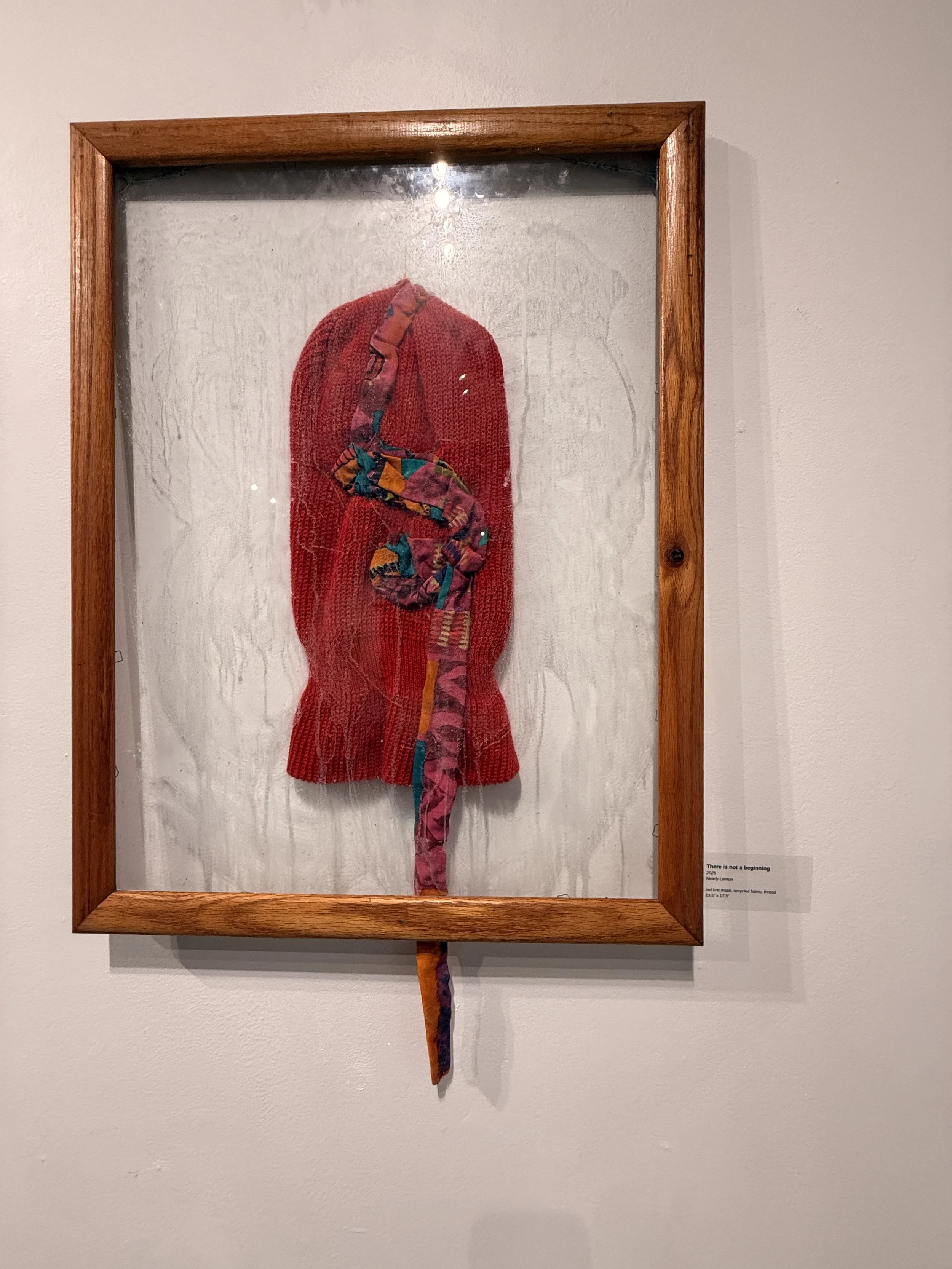 Installation Image I
There is not a beginning
2025
Nearly Lemon

red knit mask, recycled fabric, thread in frame
23.5” x 17.5”