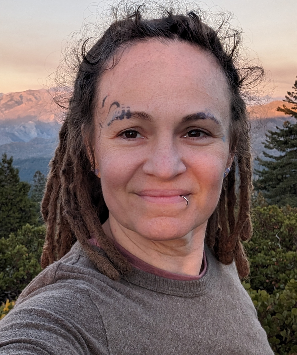 picture of me (Jamie, Compassion Witch) with mountains behind me