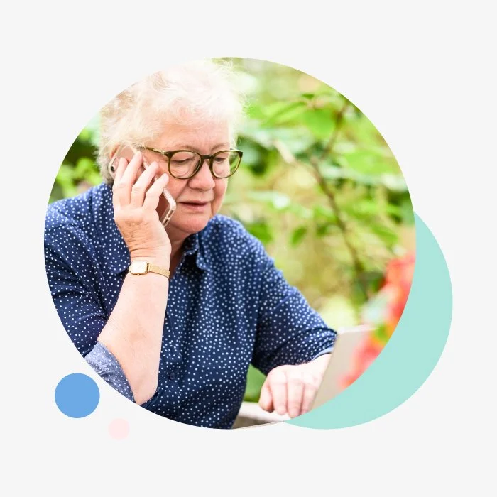 A older lady making a call on her mobile