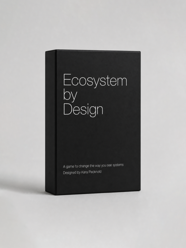 Black box titled "Ecosystem by Design" with subtitle "A game to change the way you see systems," designed by Kara Pecknold, on a plain gray background.