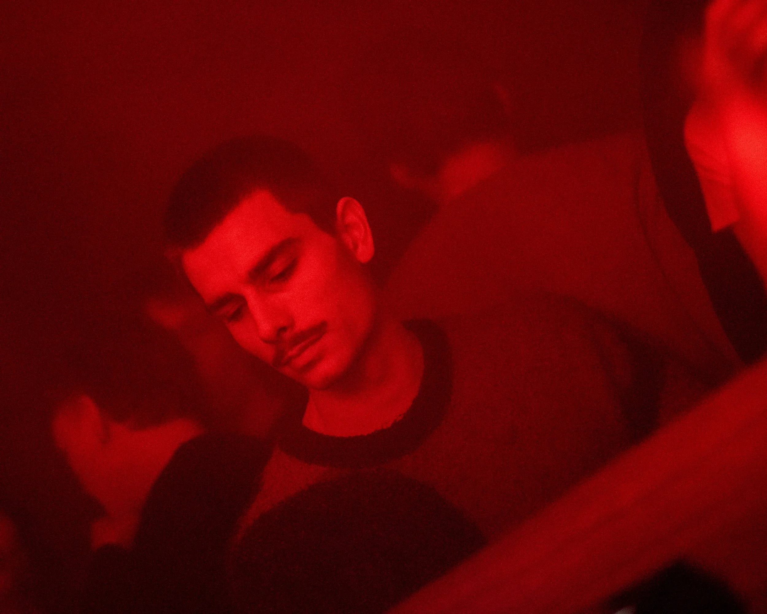 Person in a dimly lit red environment