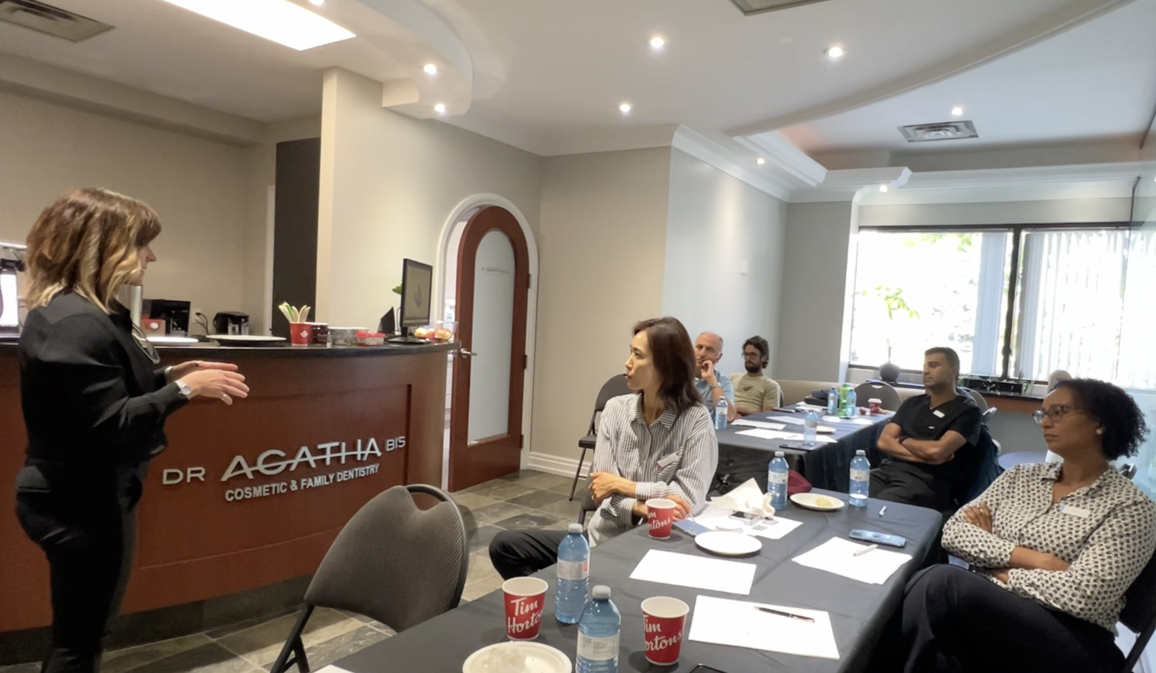 Dentist studying TMJ diagnosis and occlusion principles taught by Dr. Agatha Bis.