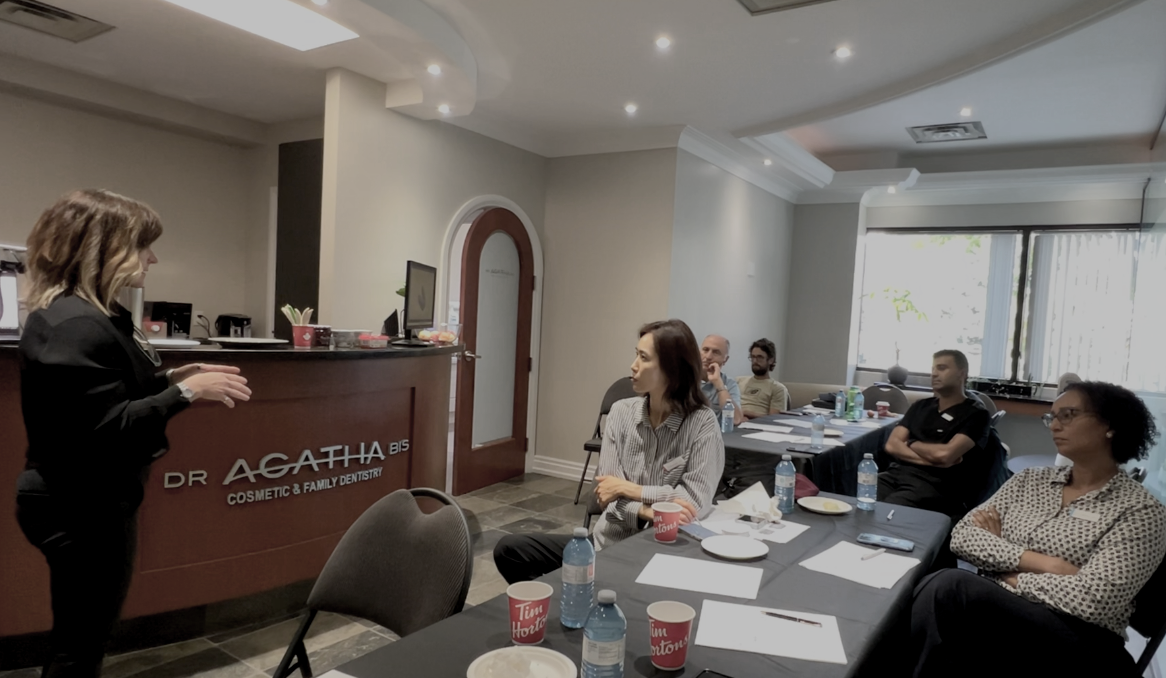 Dentist studying TMJ diagnosis and occlusion principles taught by Dr. Agatha Bis.