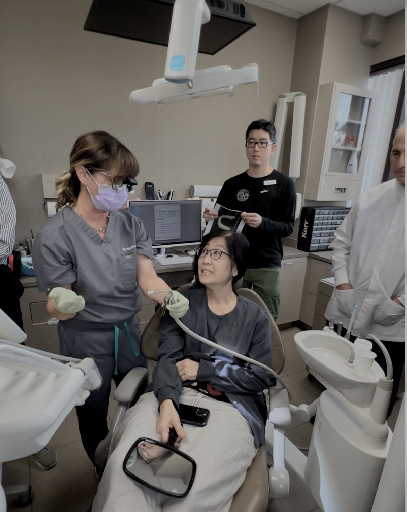 Hands-on TMJ and occlusion course image showing dentists learning functional bite analysis through real clinical application rather than theory alone. Dr. Agatha Bis