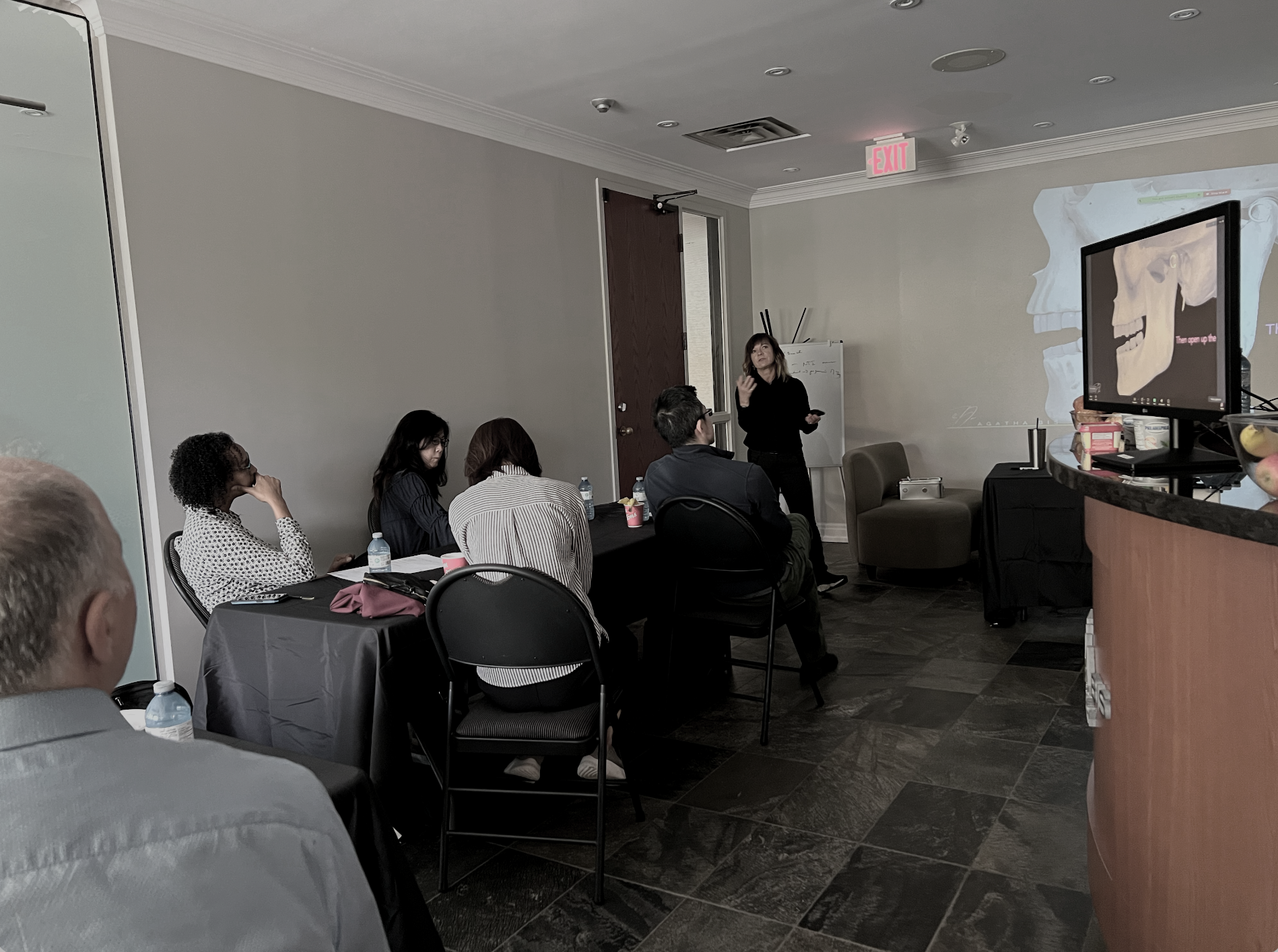 Clinical training environment where dentists practice TMJ evaluation and occlusal analysis under guided instruction. Dr. Agatha Bis