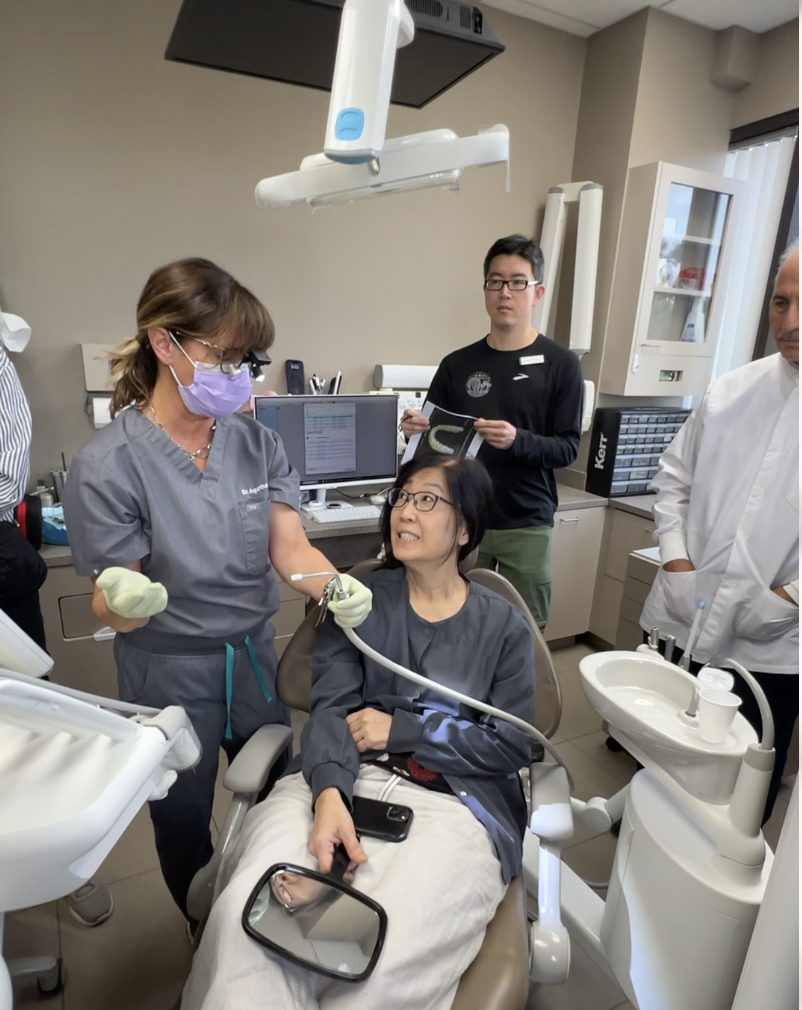 Hands-on TMJ and occlusion course image showing dentists learning functional bite analysis through real clinical application rather than theory alone. Dr. Agatha Bis
