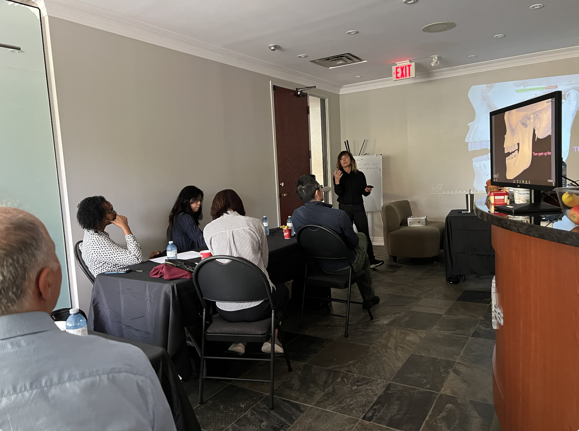 Clinical training environment where dentists practice TMJ evaluation and occlusal analysis under guided instruction. Dr. Agatha Bis