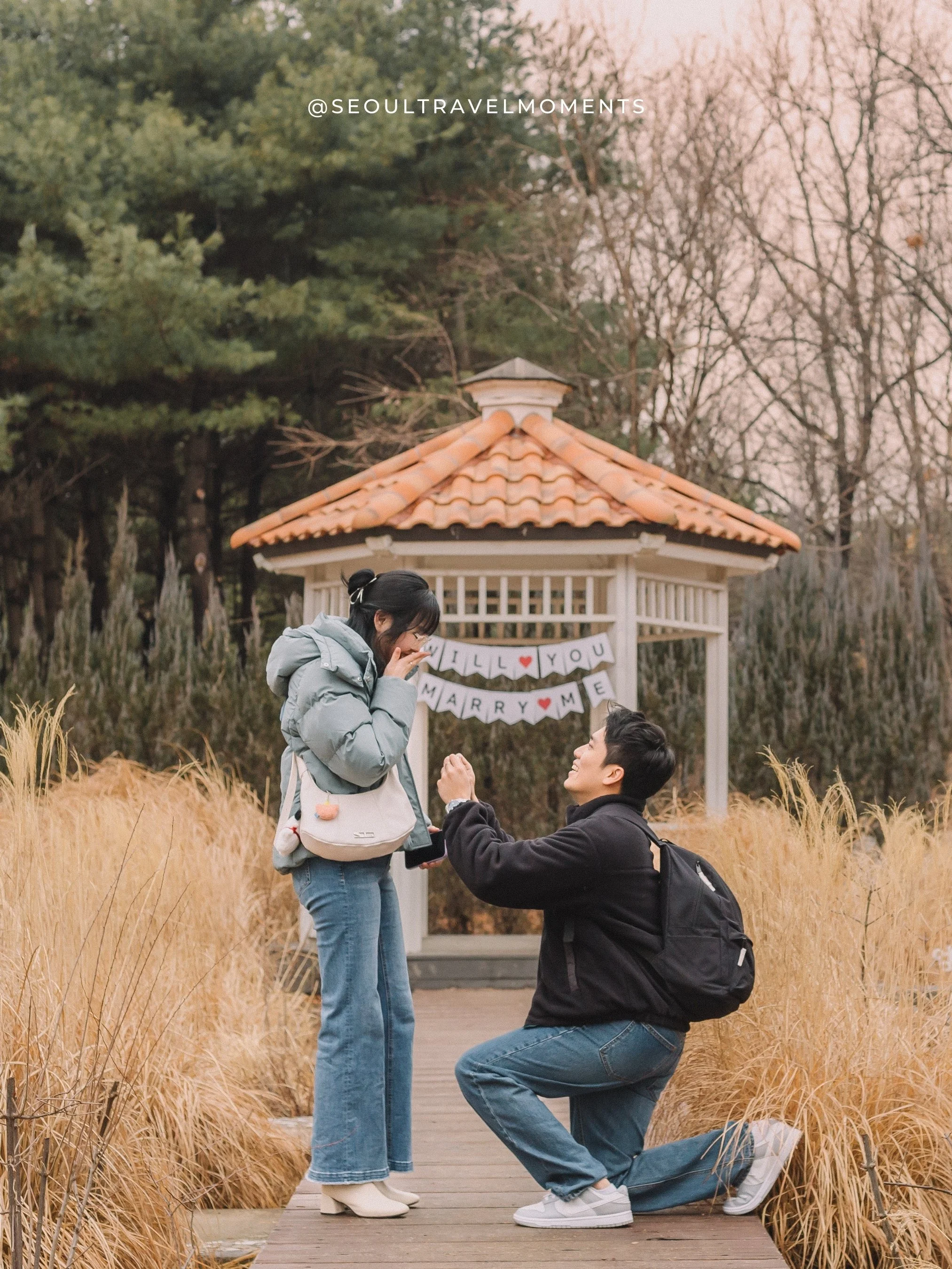 Seoul proposal photoshoot at Seoul Forest Park, documenting an emotional engagement moment in a tree-lined park.