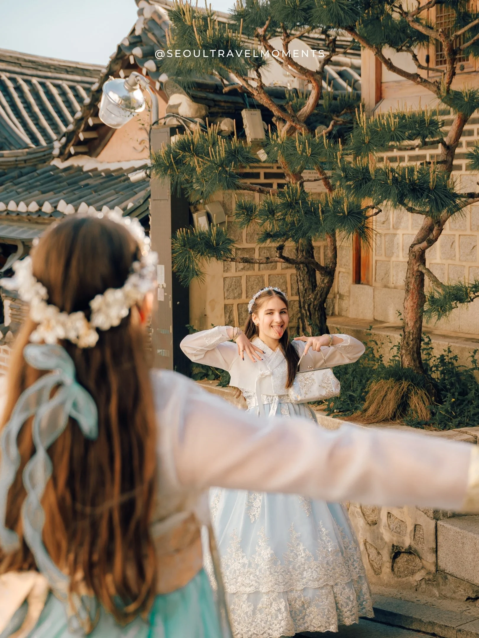 Natural light family photography in Seoul with a mom and daughters wearing hanbok