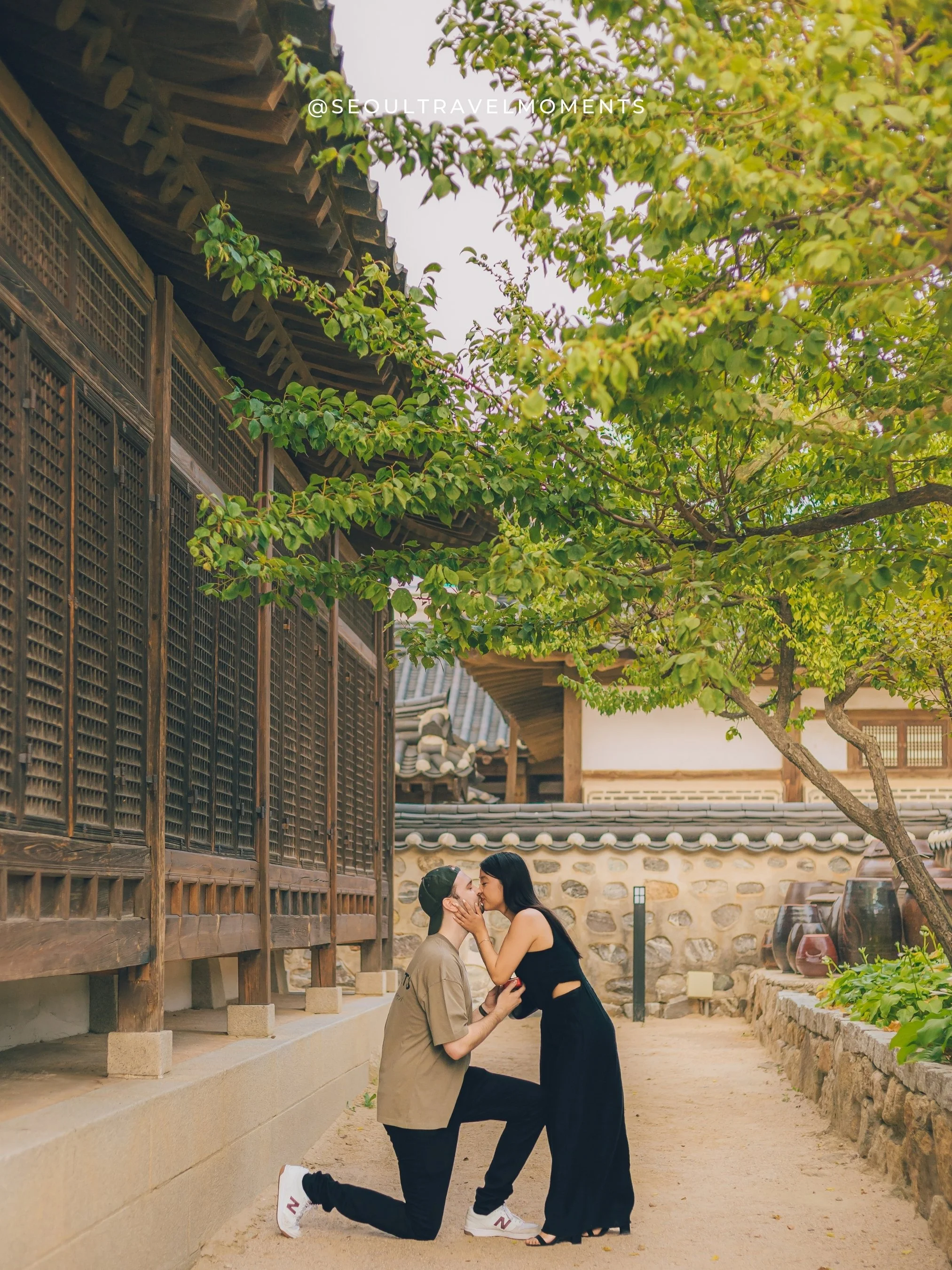 Proposal photoshoot at Namsangol Hanok Village in Seoul, capturing a couple during a traditional hanok engagement moment.