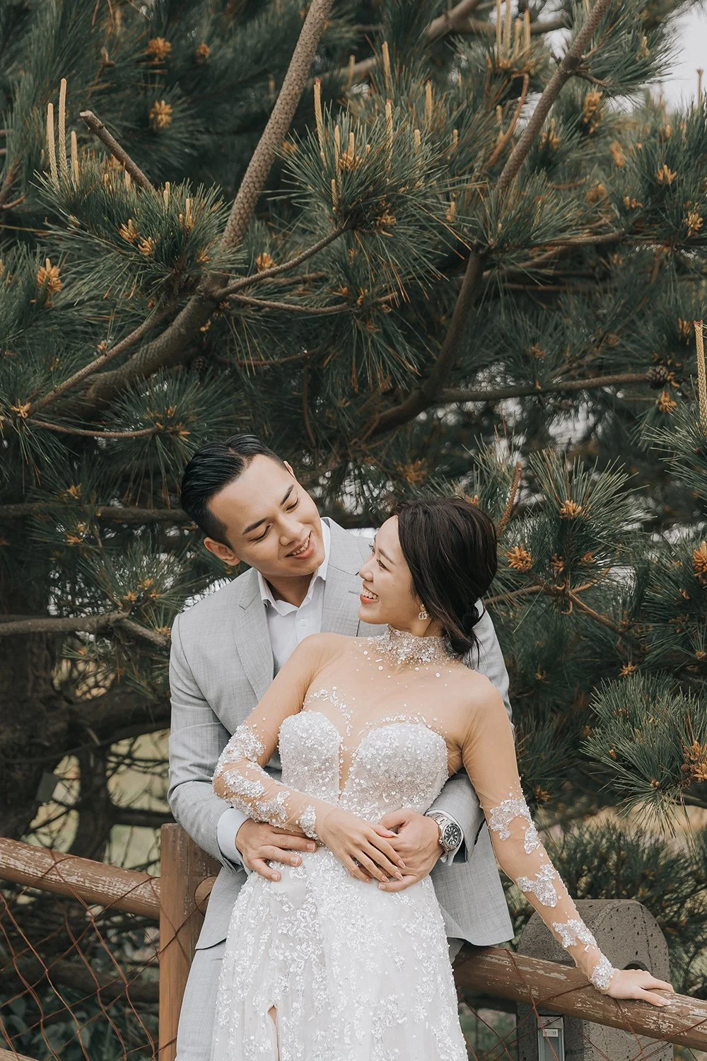 Couple photoshoot at Seongsan Ilchulbong Jeju Island with soft foggy light creating a cinematic and tender portrait