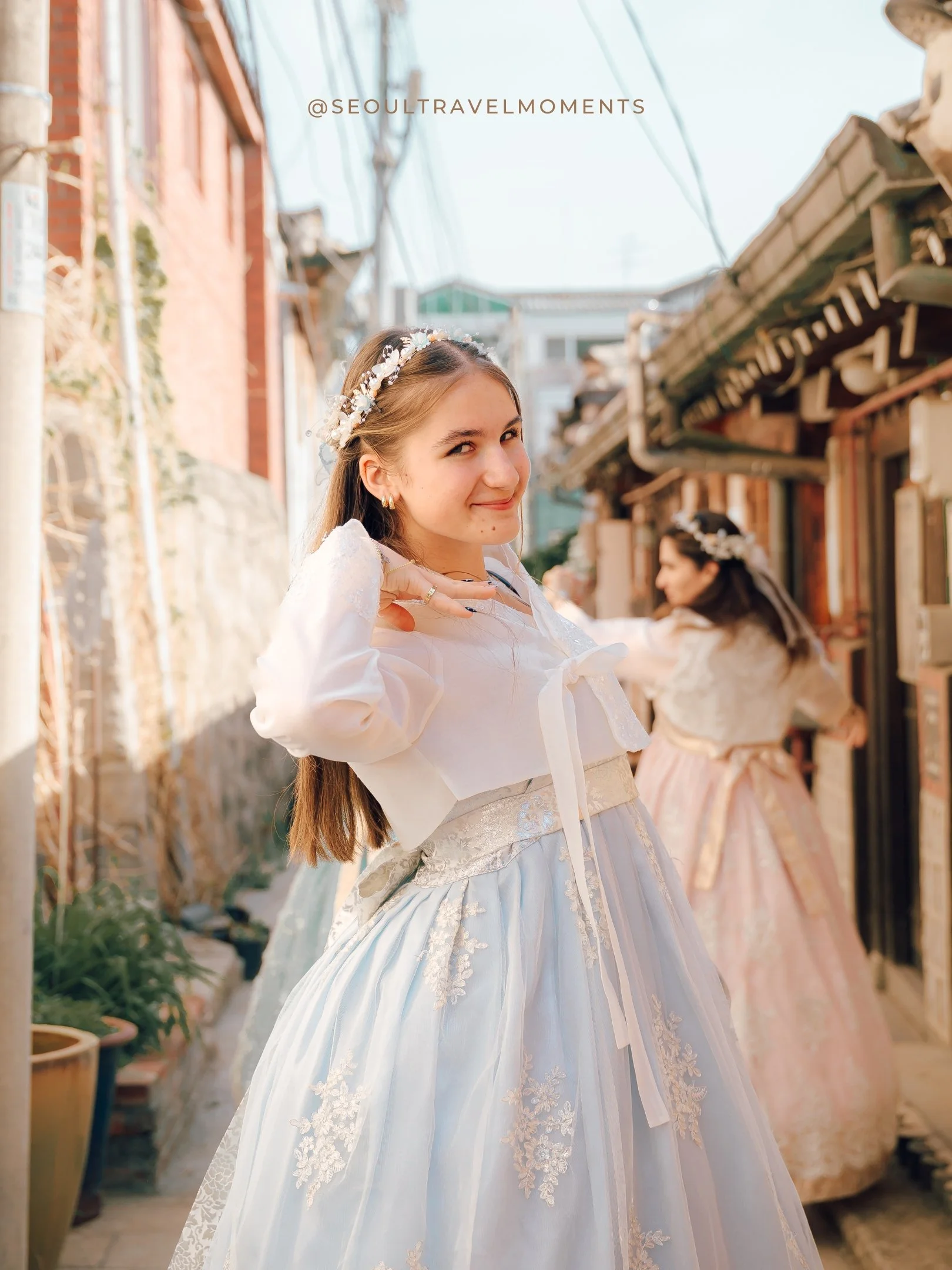 Children spinning in hanbok during a movement-based family photoshoot in Seoul
