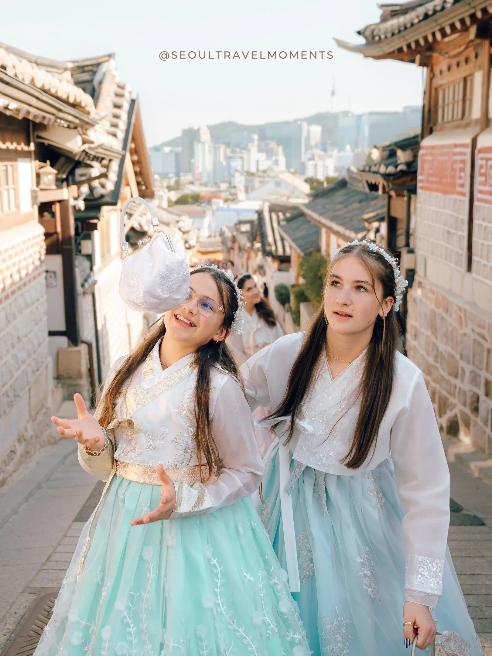 Documentary style family photography in Seoul with children moving freely in hanbok