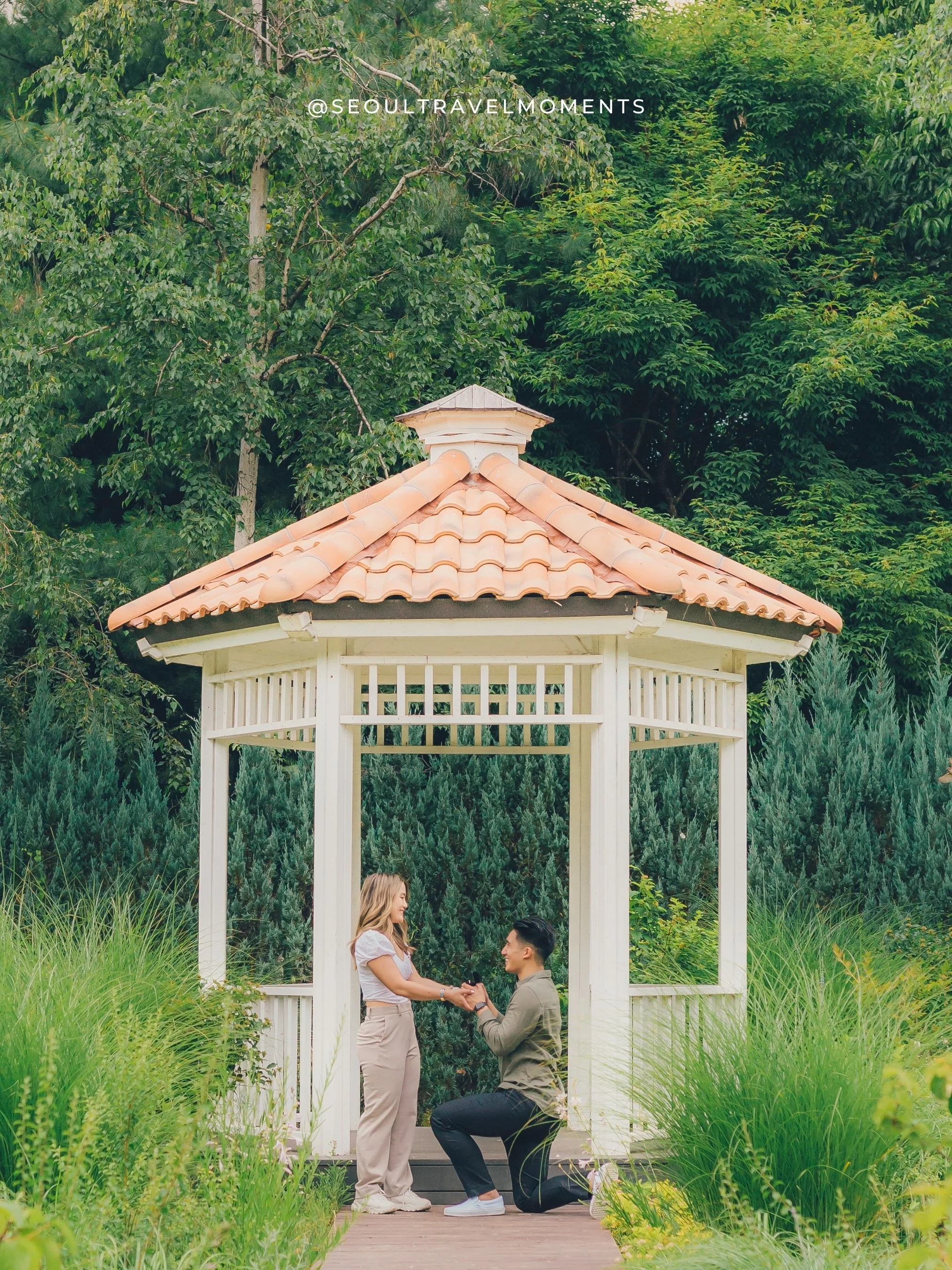 Proposal photography at Seoul Forest Park in Seoul, capturing a couple during a candid engagement moment surrounded by greenery.