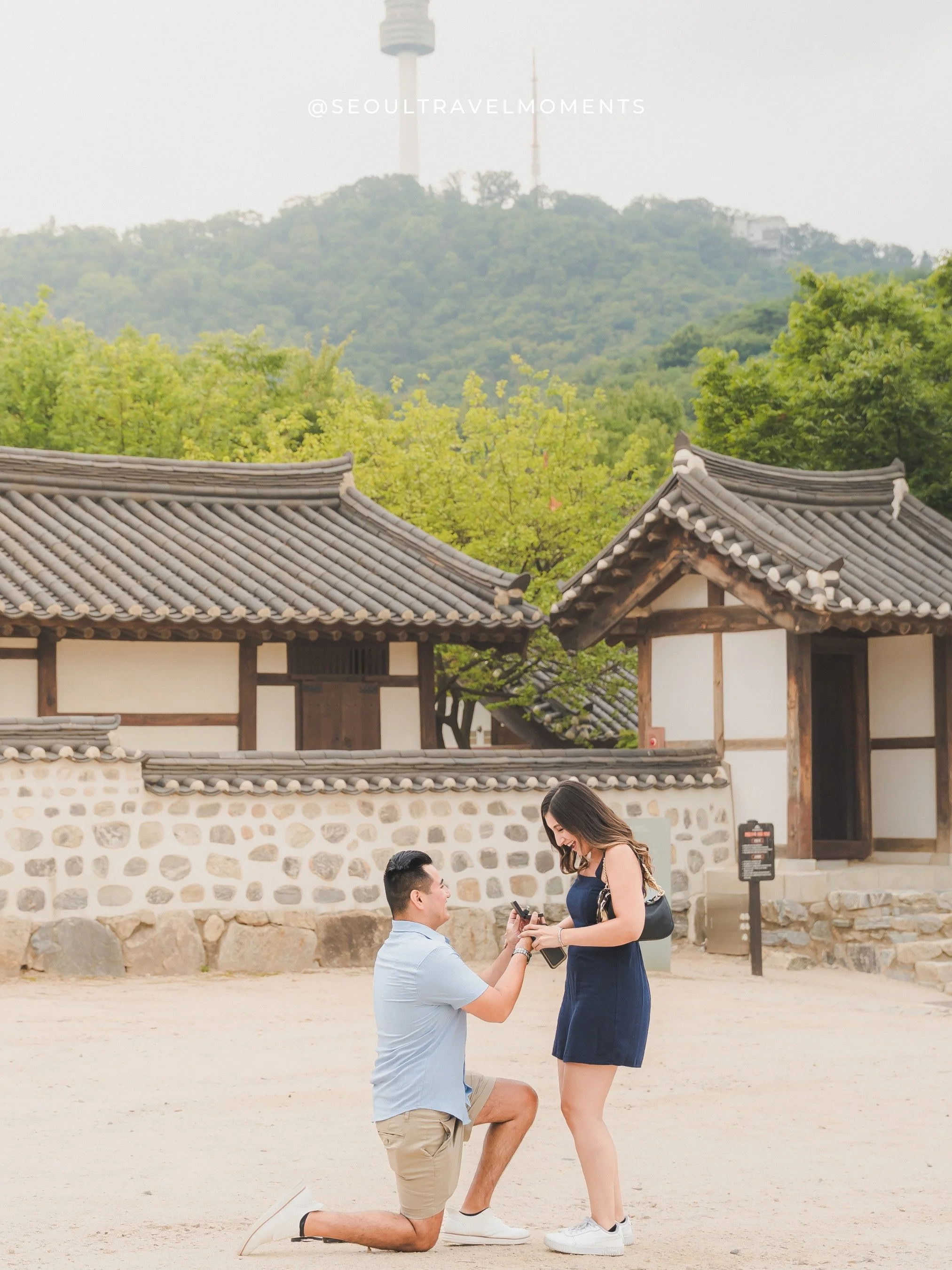 Proposal and engagement photoshoot at Namsangol HanokVillage, capturing a couple saying yes during a surprise proposal in Seoul.